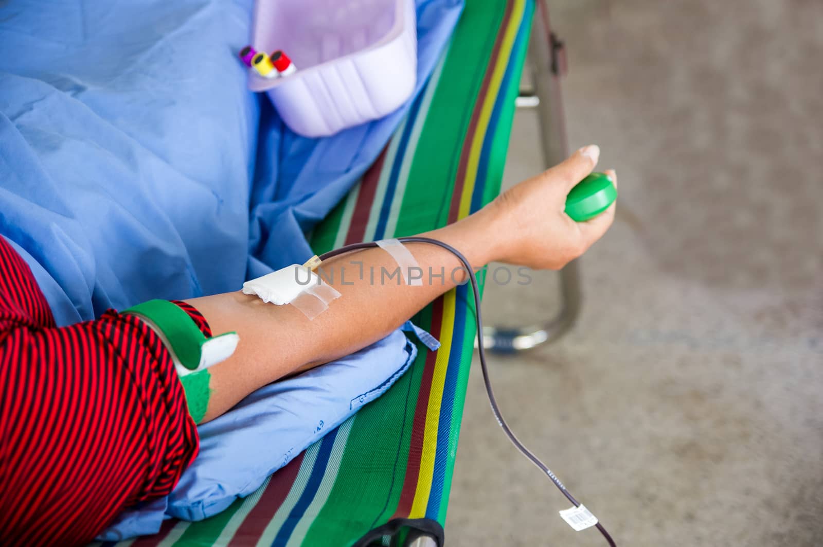 Closeup of blood donor at donation.