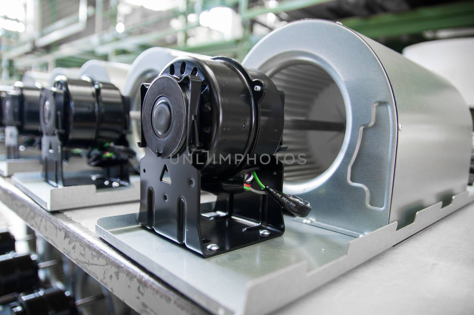 fan motors on the rollers gravitational ready to be used on the assembly line