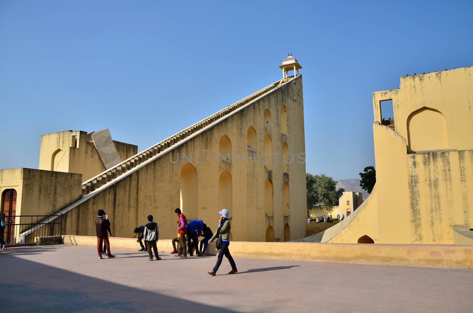 Jaipur, India - December 29, 2014: Tourist visit Jantar Mantar observatory on December 29, 2014 in Jaipur, India. The collection of architectural astronomical instruments, were built by Sawai Jai Singh II in 1727-1734.