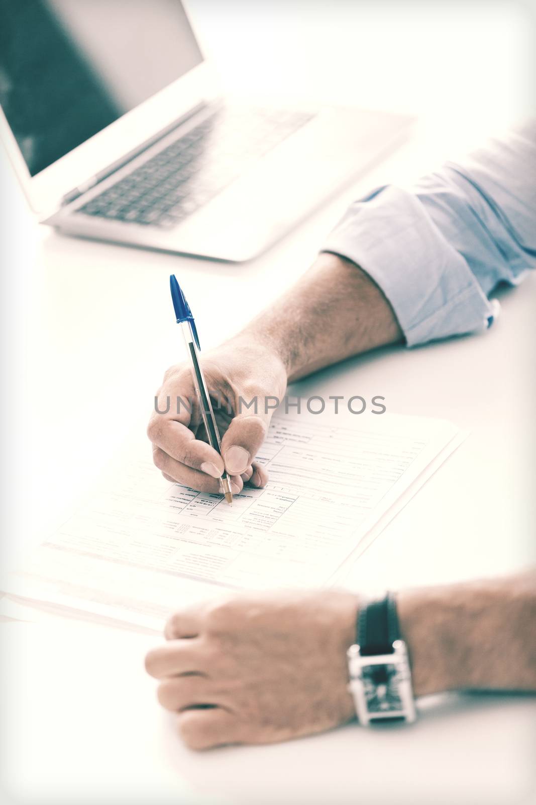 man signing a contract by dolgachov