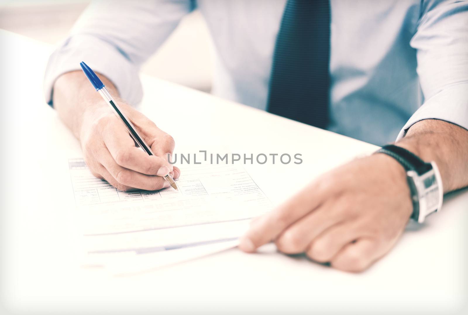 man signing a contract by dolgachov