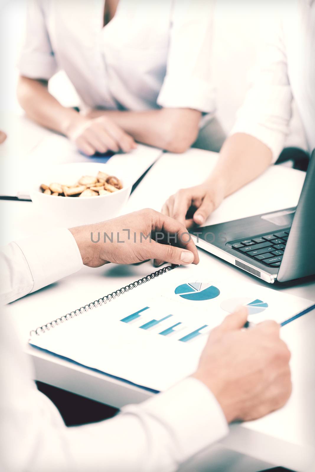 business, school and education concept - friendly business team having discussion in office