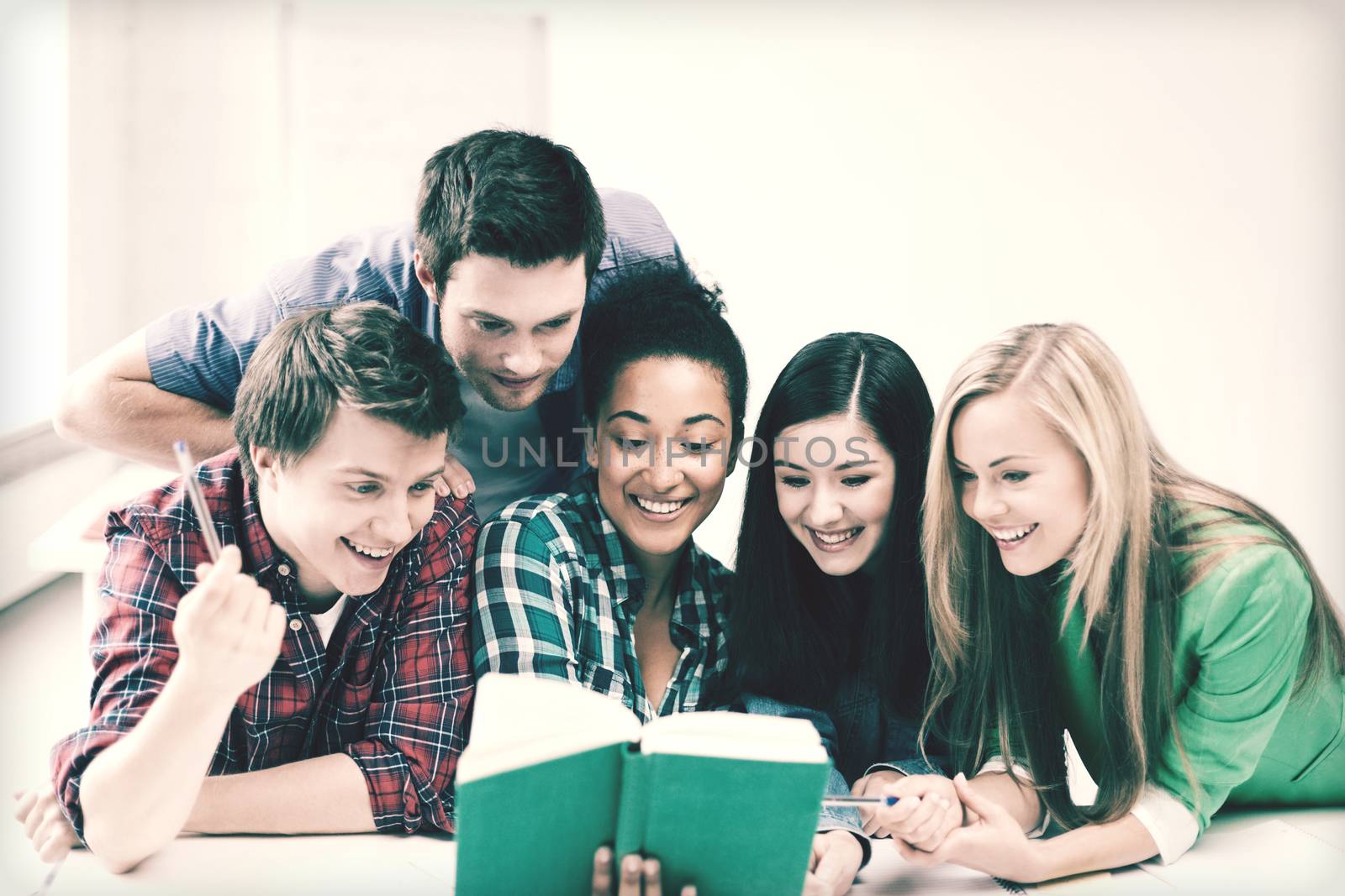 students reading book at school by dolgachov