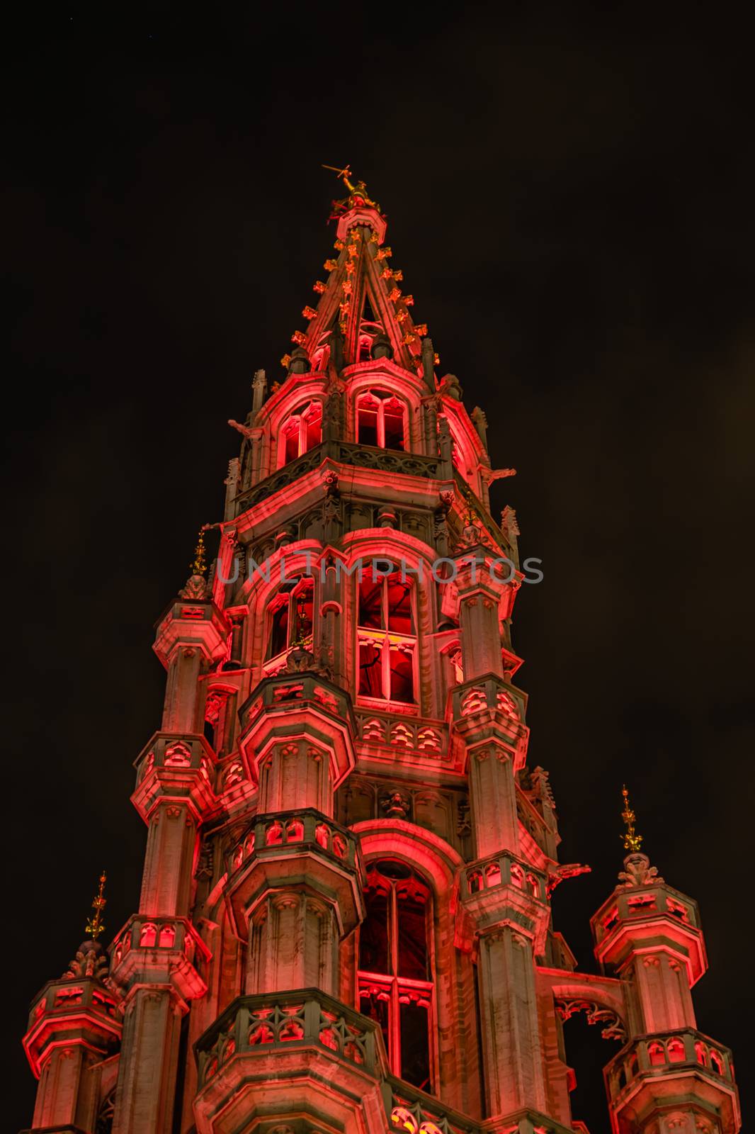 Night view of the tower of the ancient Town Hall in the Grand Place, Brussels, Belgium.