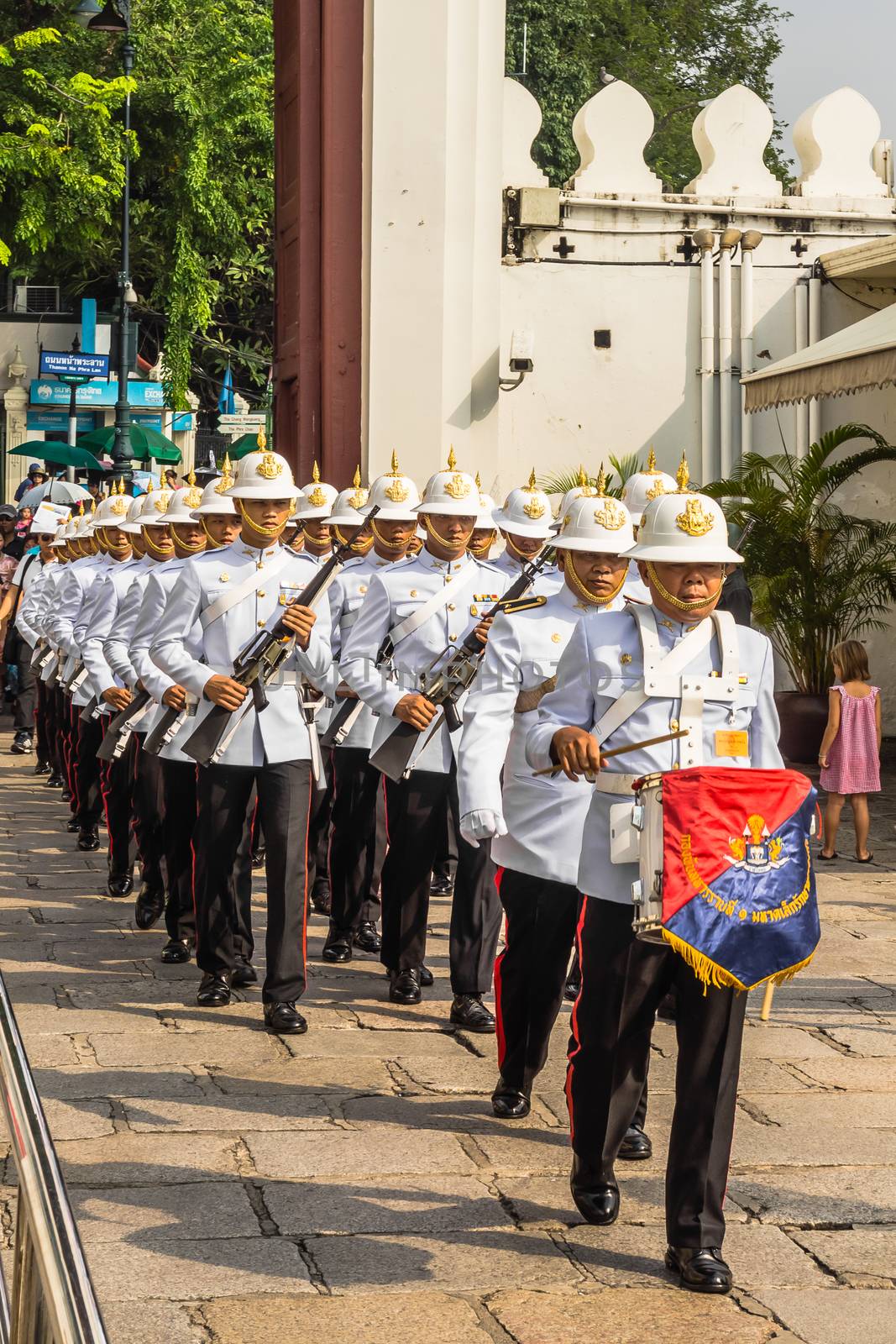 Changing of the guard at The Grand Palace in Bangkok, historical seat of Kings of Siam, main tourist attraction of the city, still used for official events.