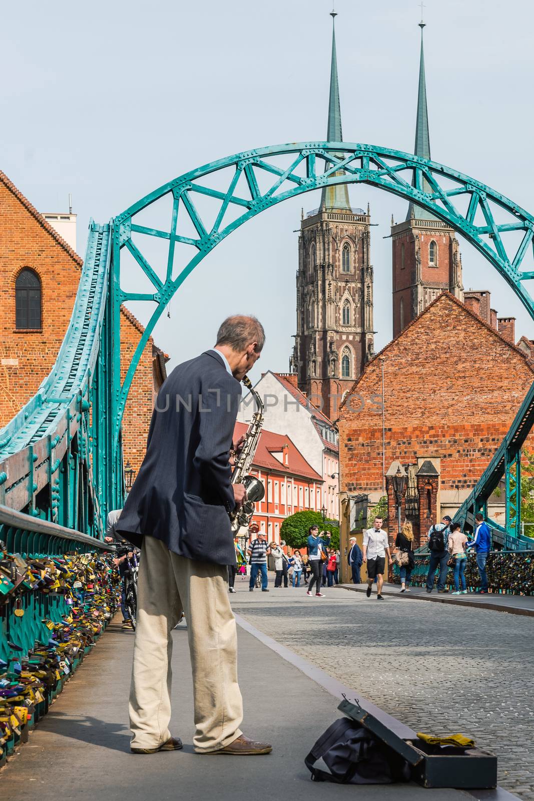 Scenes from Tumski Bridge in Wroclaw over the north branch of the Oder River. Also known as Lovers Bridge where lovers leave padlocks symbolizing a strength of their feelings.