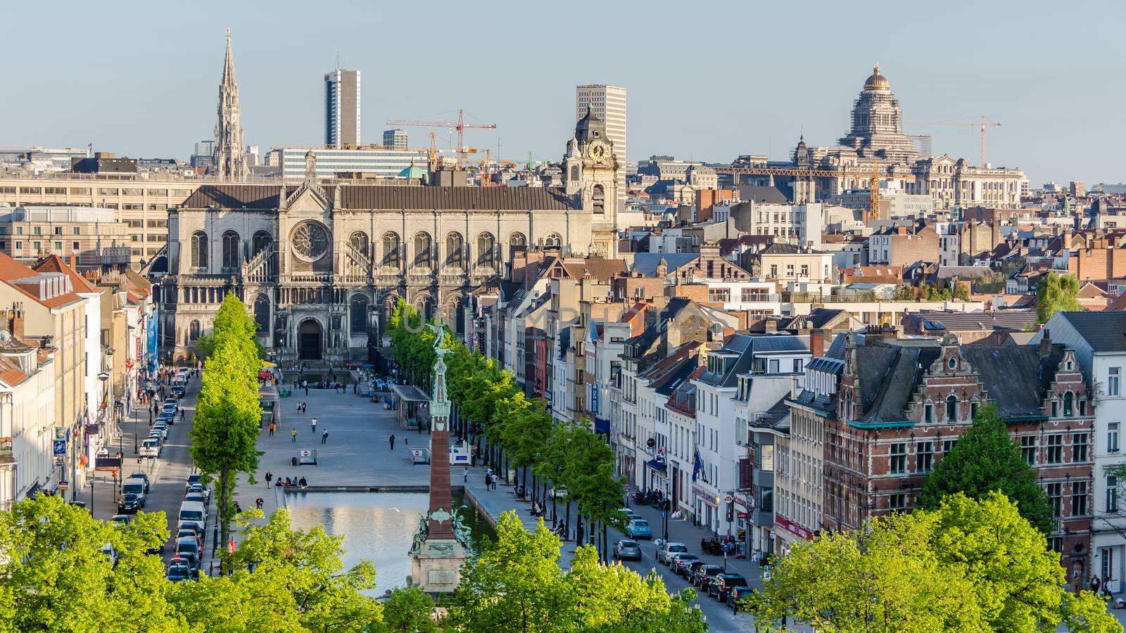 Saint Catherine's Church in Brussels on the background of city skyline on May 05, 2013. Closed due to lack of faithful and desecrated, planned to be converted into a fruit and vegetables market