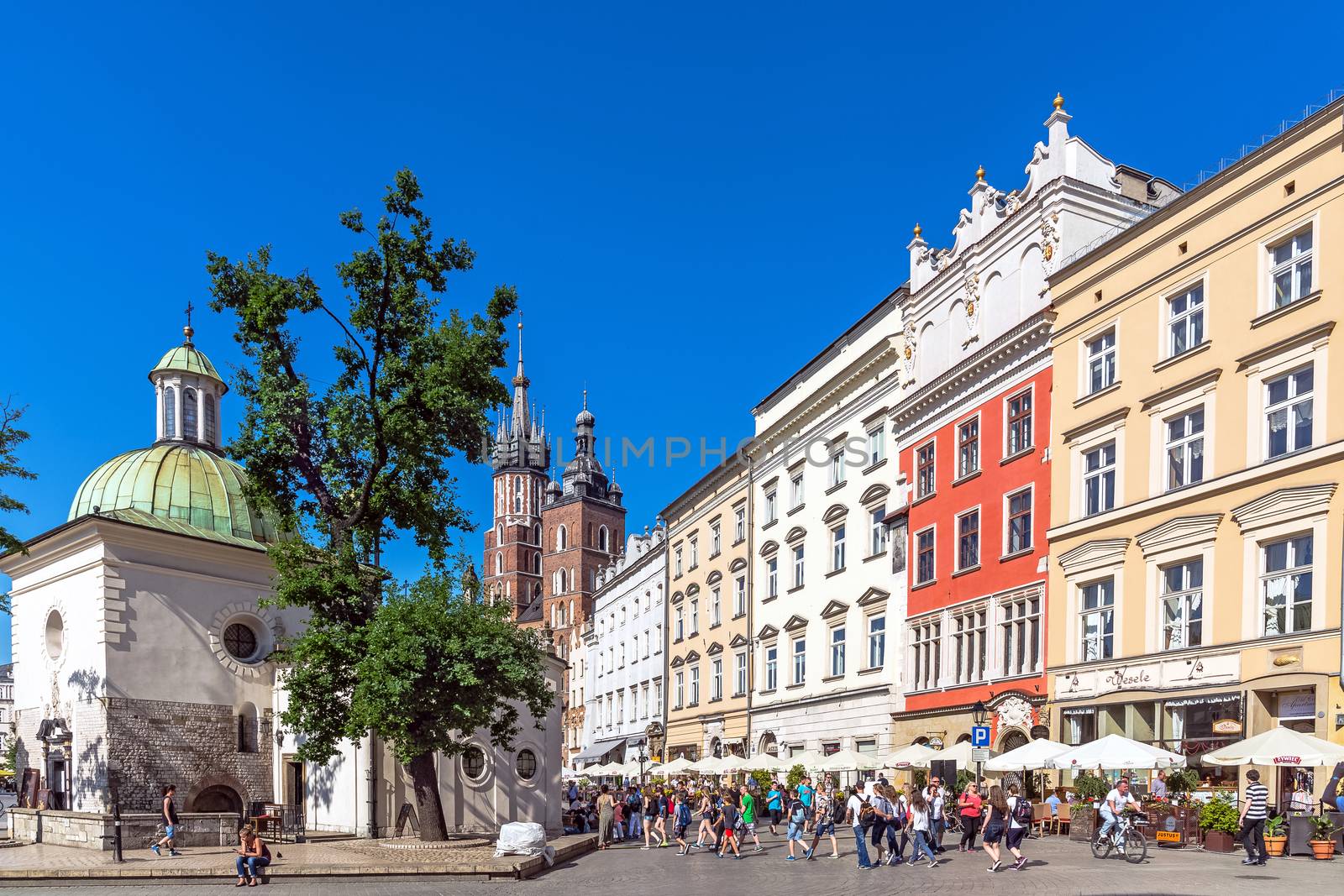 St. Adalbert (in the foreground) and St. Mary churches in the Main Square in Krakow, the most popular destination in Poland, full of many attractions for tourists.