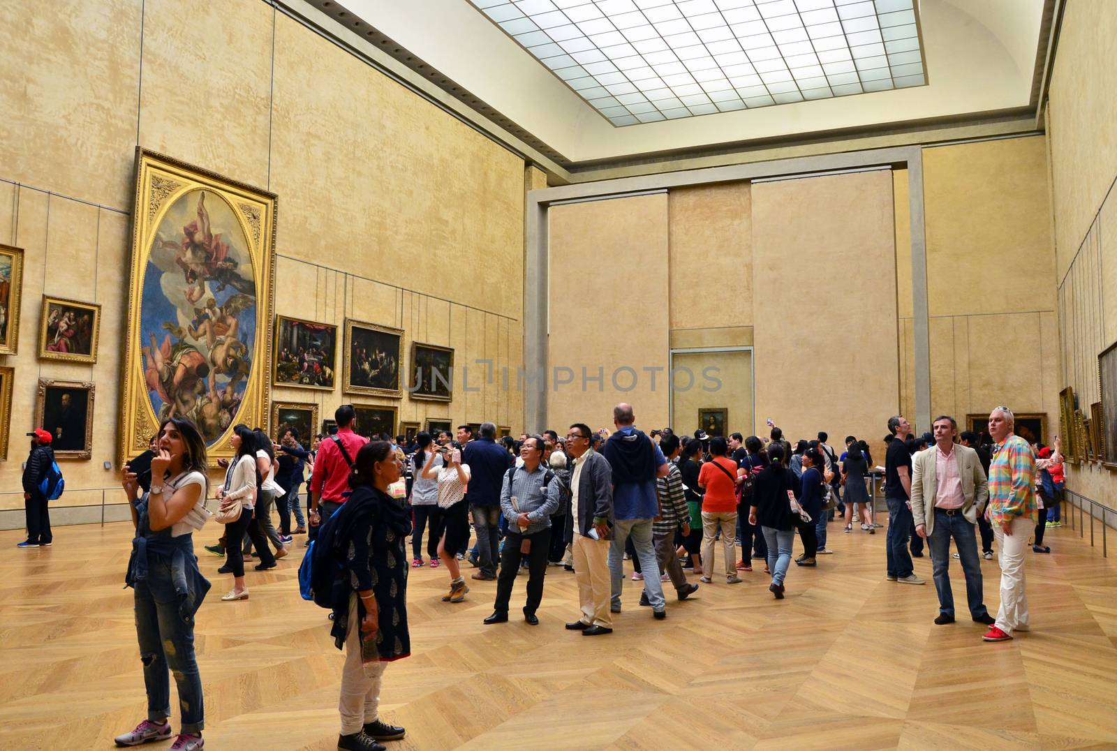Paris, France - May 13, 2015: Visitors Louvre Museum, Paris, France. With 8.5 m annual visitors, Louvre is consistently the most visited museum worldwide.