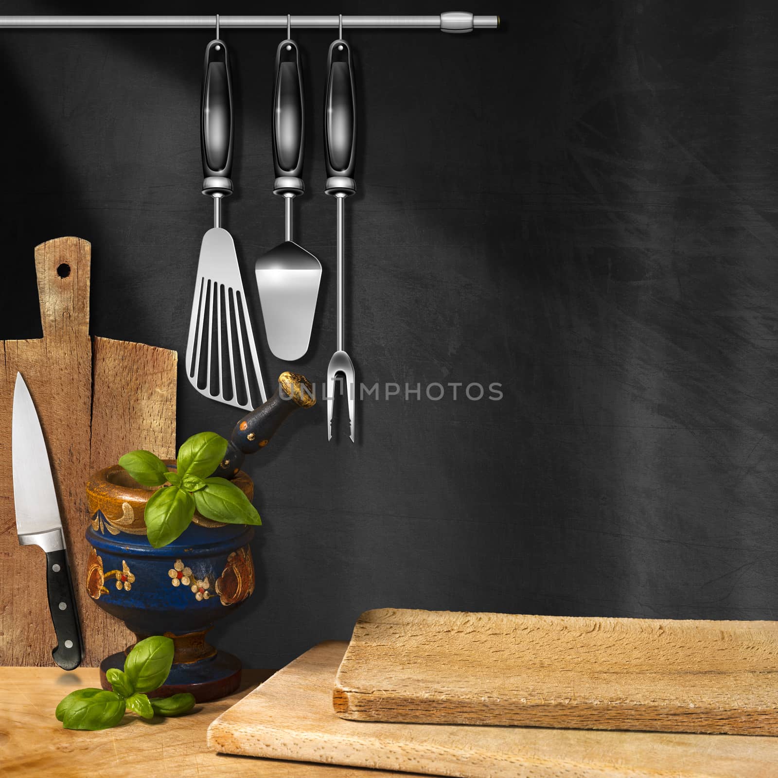 Empty blackboard on the wall, mortar and pestle with basil leaves, cutting boards and kitchen utensils. Template for recipes or food menu