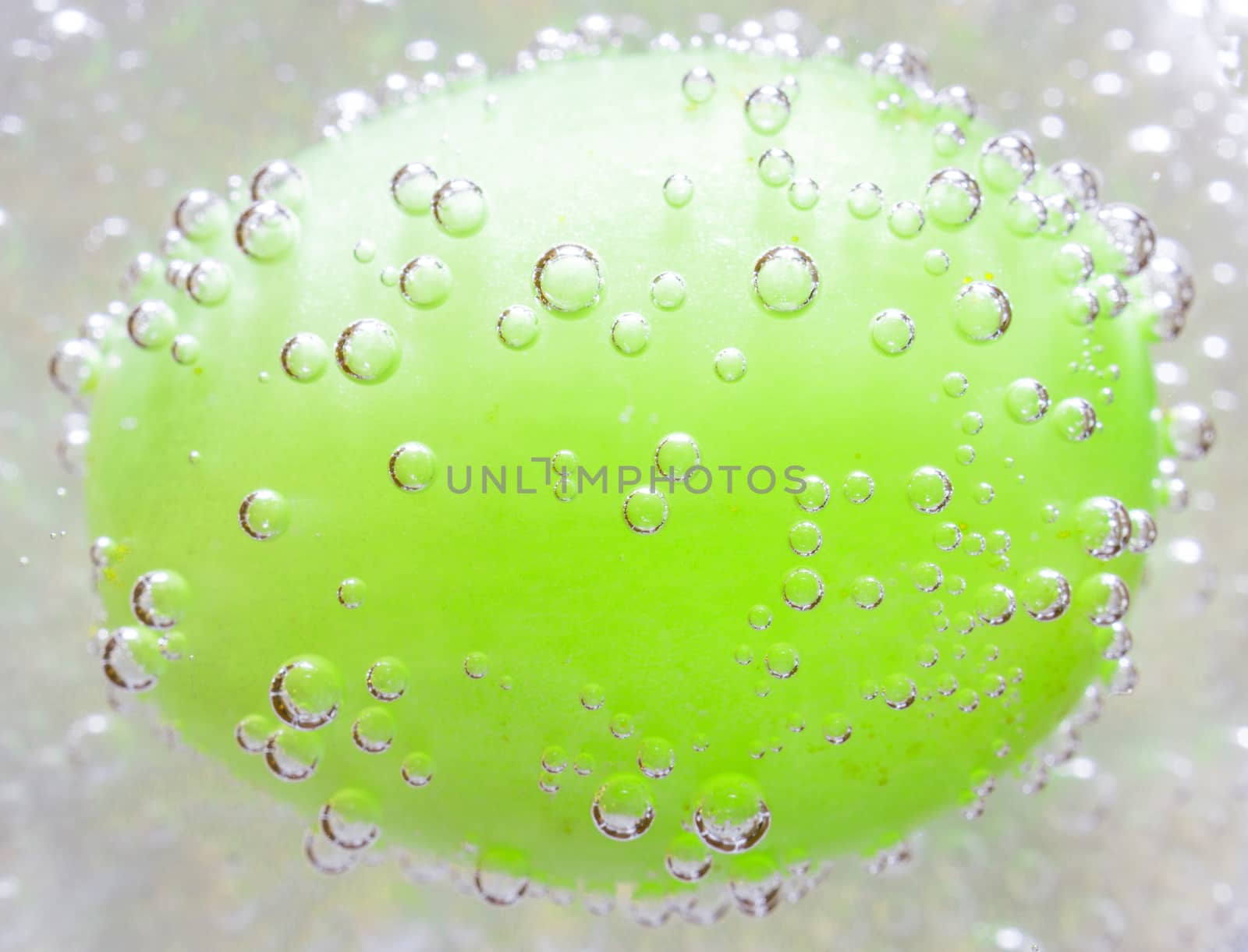 The photo depicts the grapes in the bubbles