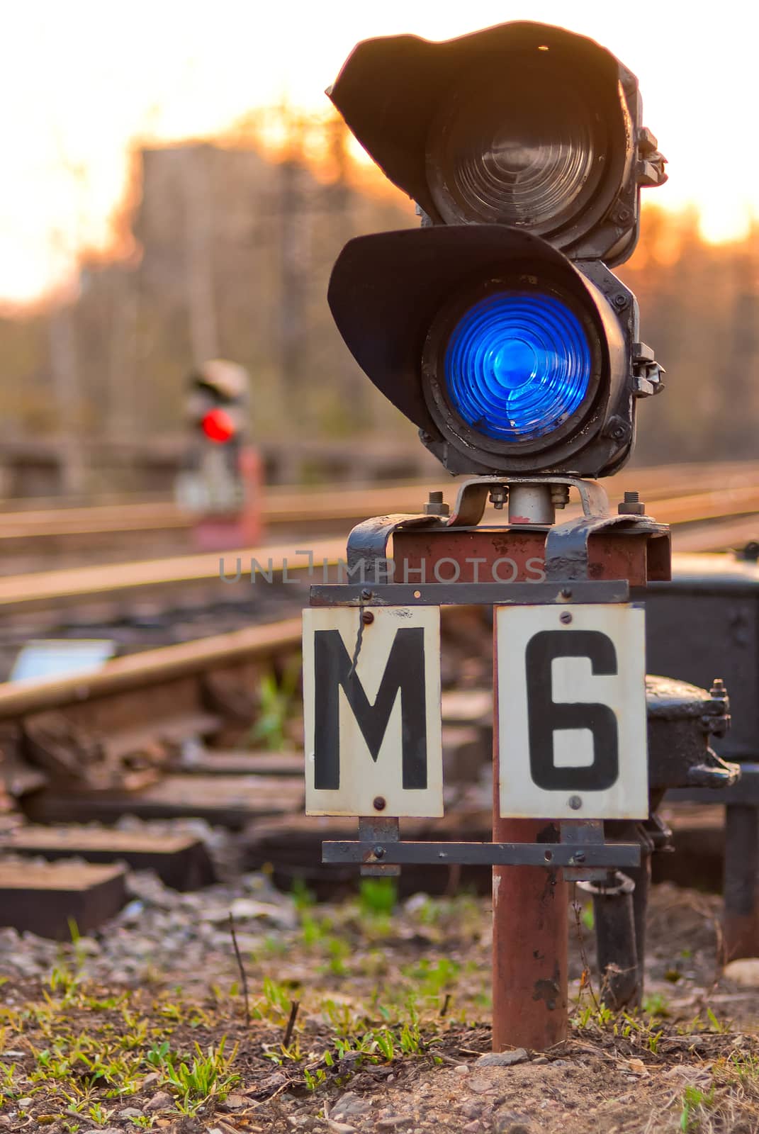 a semaphore on railway lit blue light by kosmsos111