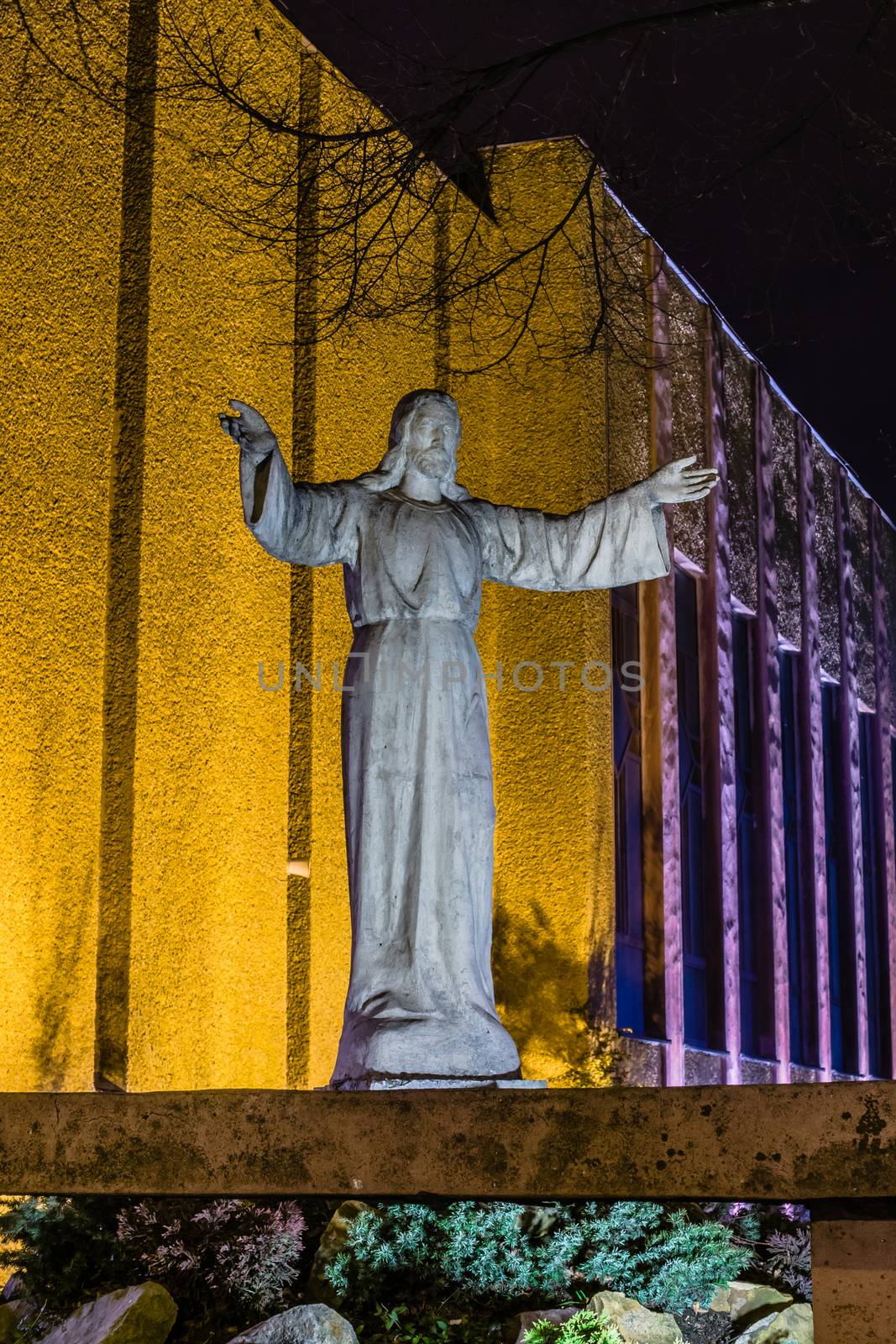 Night view of Jesus Christ statue in fornt of the church in Katowice, Poland.