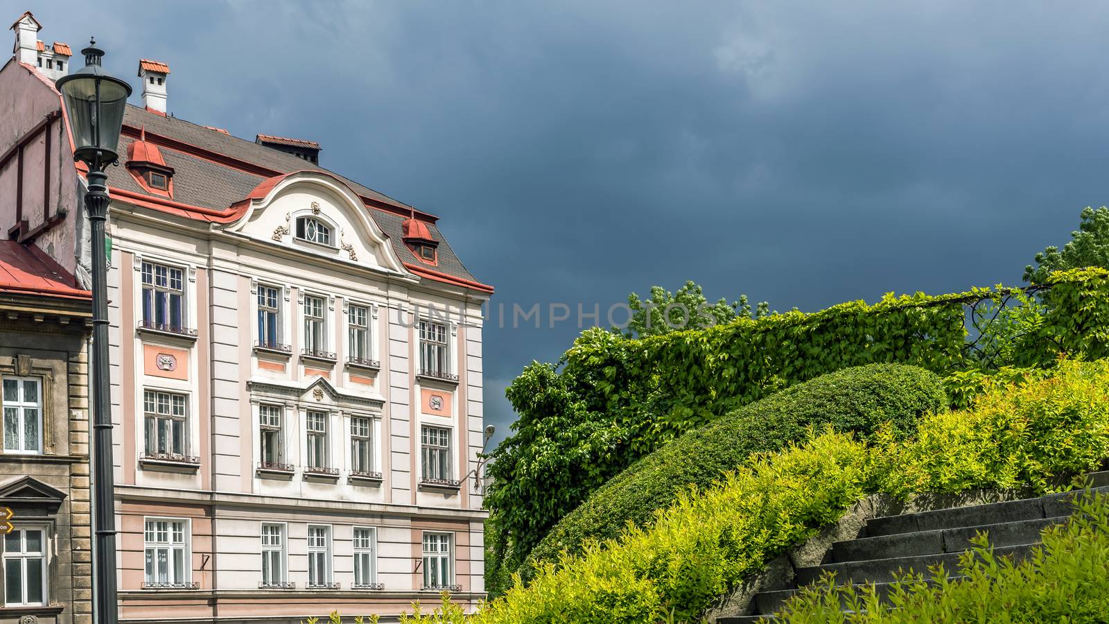 Facade of an ancient tenement at the stormy sky in Bielsko-Biala, Silesian Voivodship, Poland.