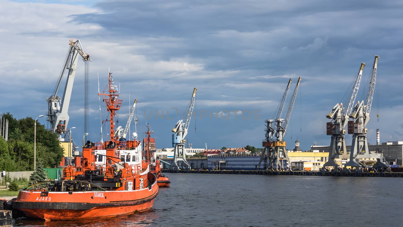 Tugboats at the quay on July 11, 2013, in the Port of Gdansk - the largest seaport in Poland, a major transportation hub in the central part of the southern Baltic Sea coast.