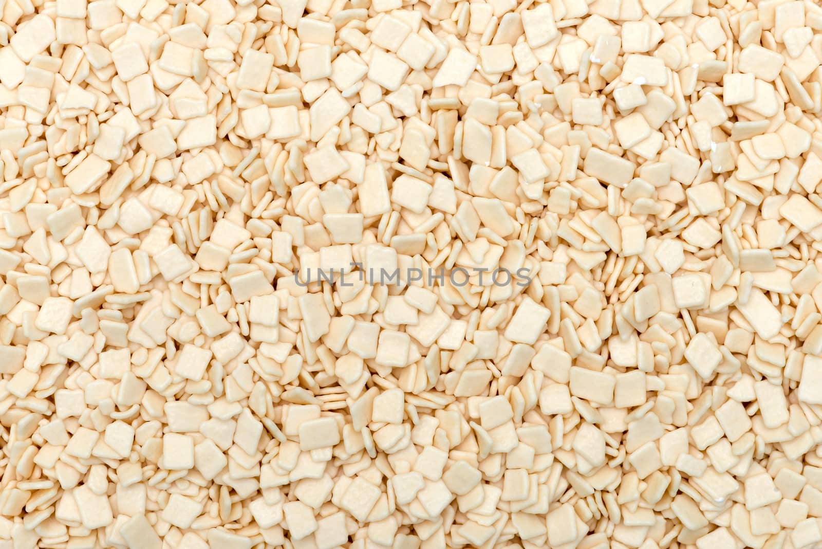 White chocolate chips as an abstract background texture