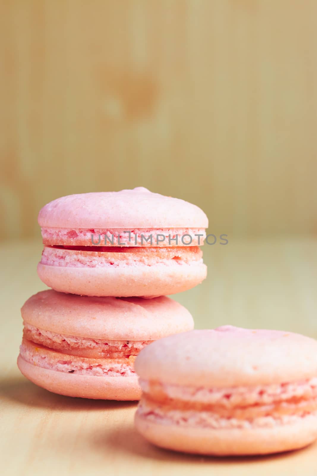 Sweet french macaroons on wooden background