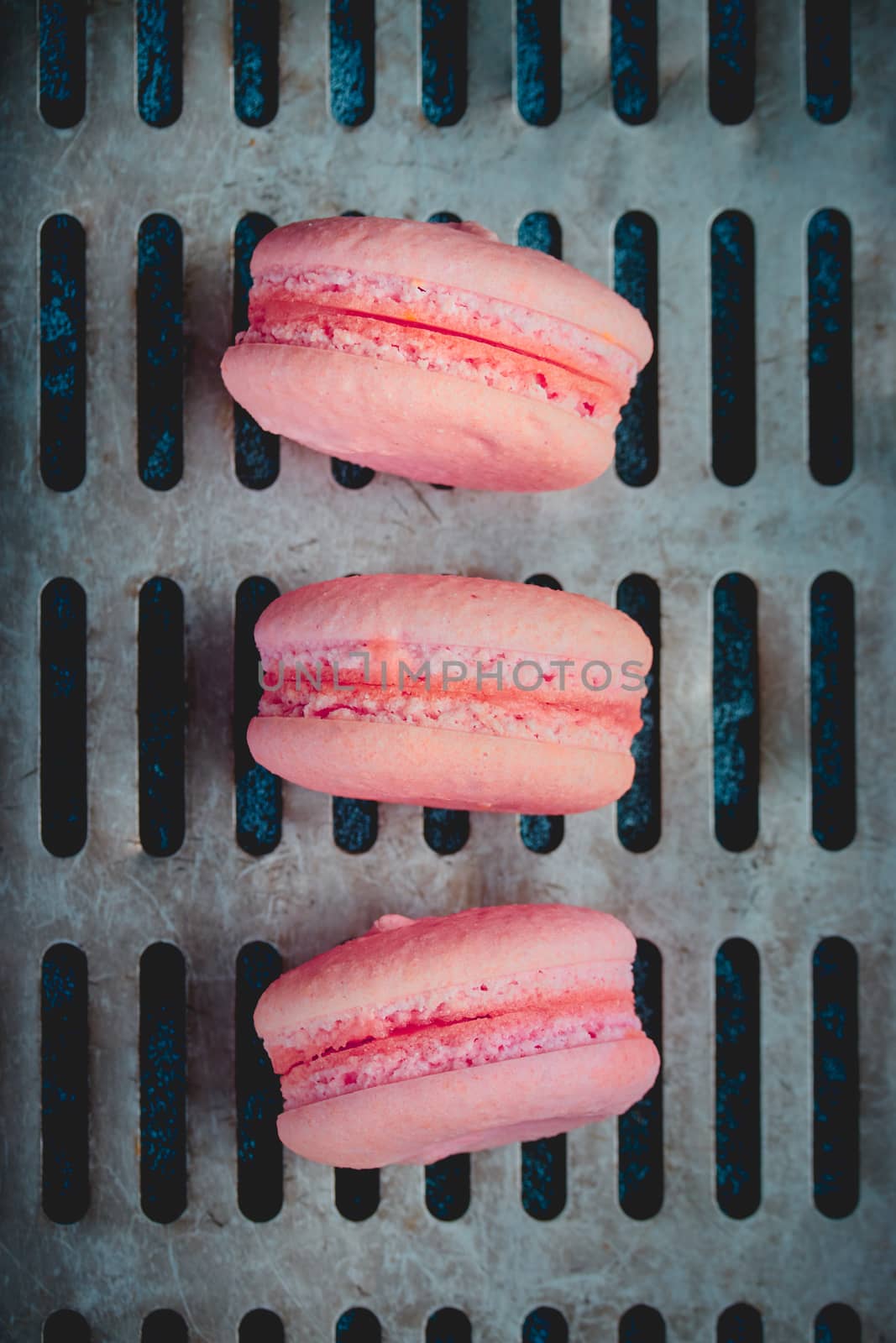 Sweet pink french macaroons close up