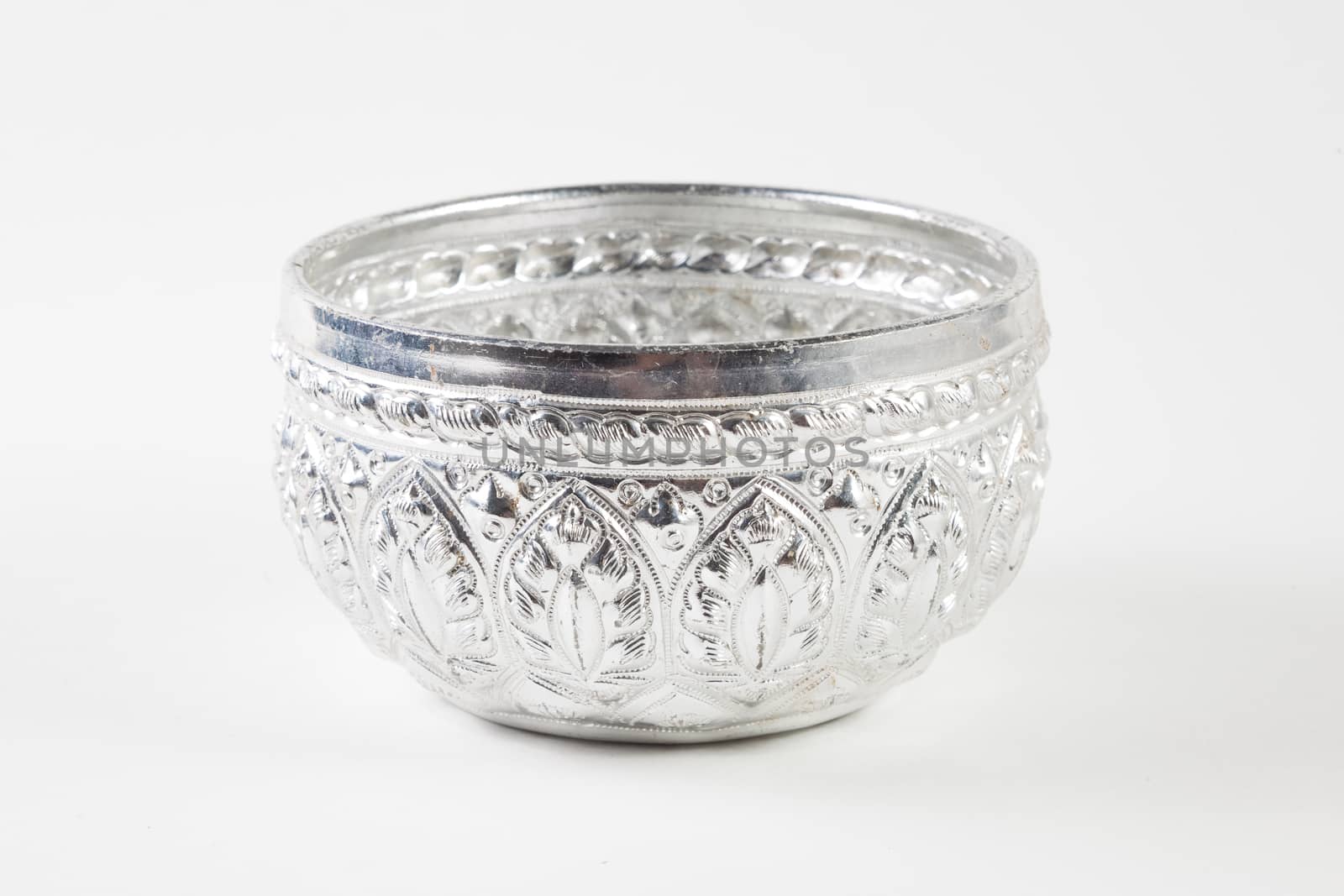 Decorated pattern silver bowl on white, isolated