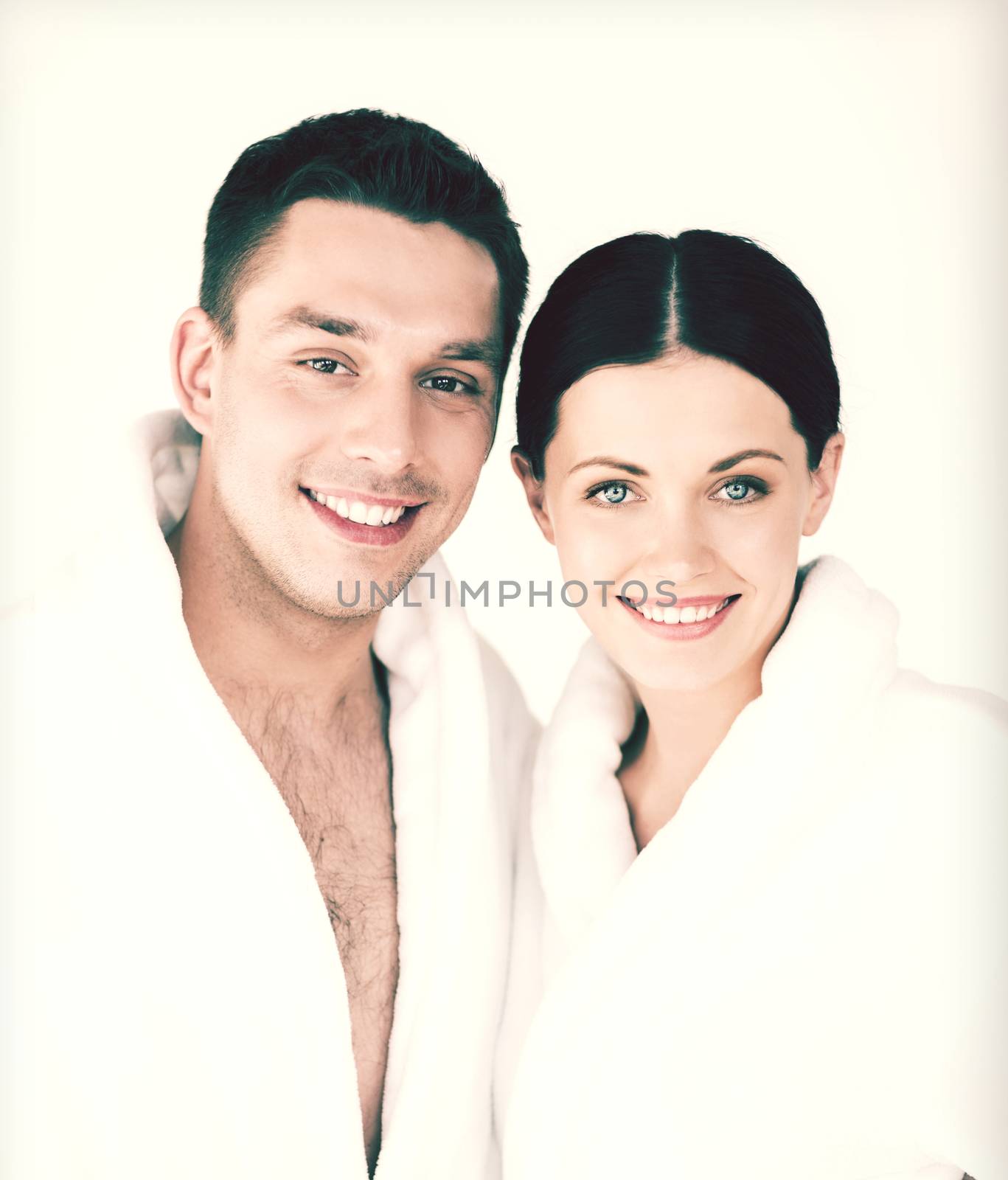 picture of couple in spa salon in white bathrobes