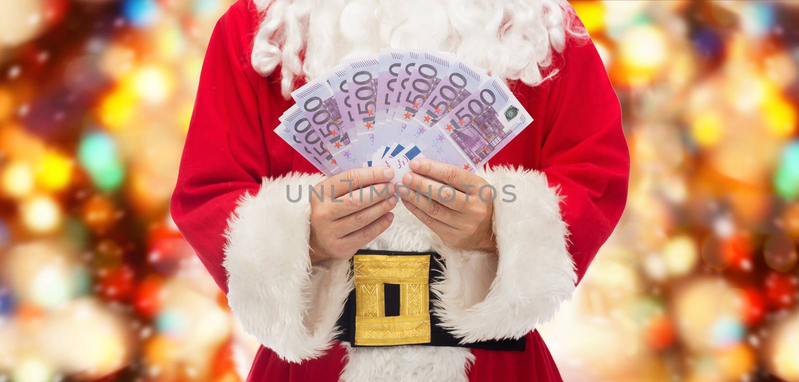 close up of santa claus with euro money by dolgachov