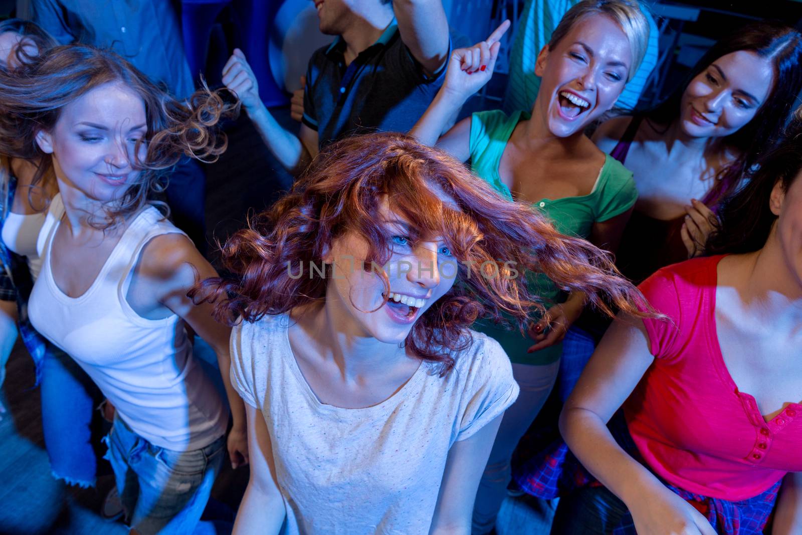 party, holidays, celebration, nightlife and people concept - smiling friends dancing in club