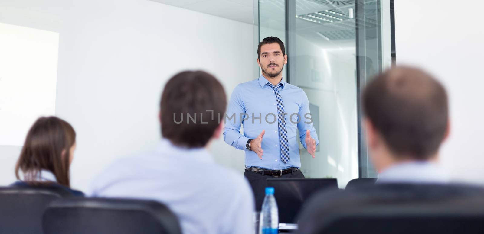 Business man making a presentation in office on job interview. Business presentation on corporate meeting. Recruiters evaluating the candidate. 