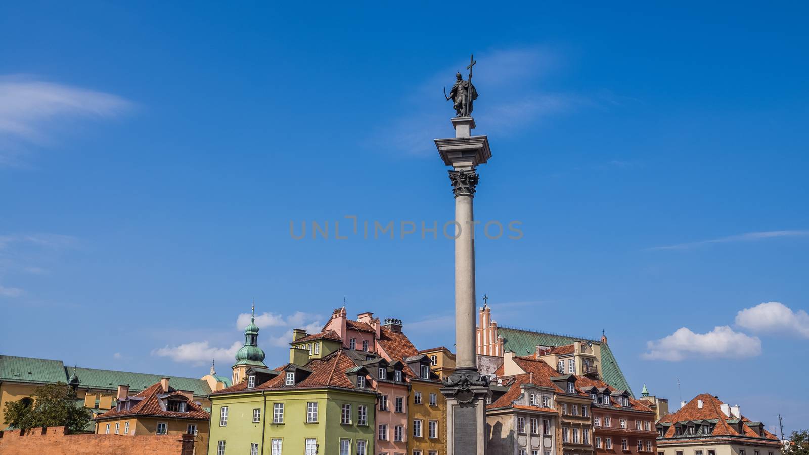 Castle Square in Warsaw, Poland with Old Town skyline and King Sigismund's Column.