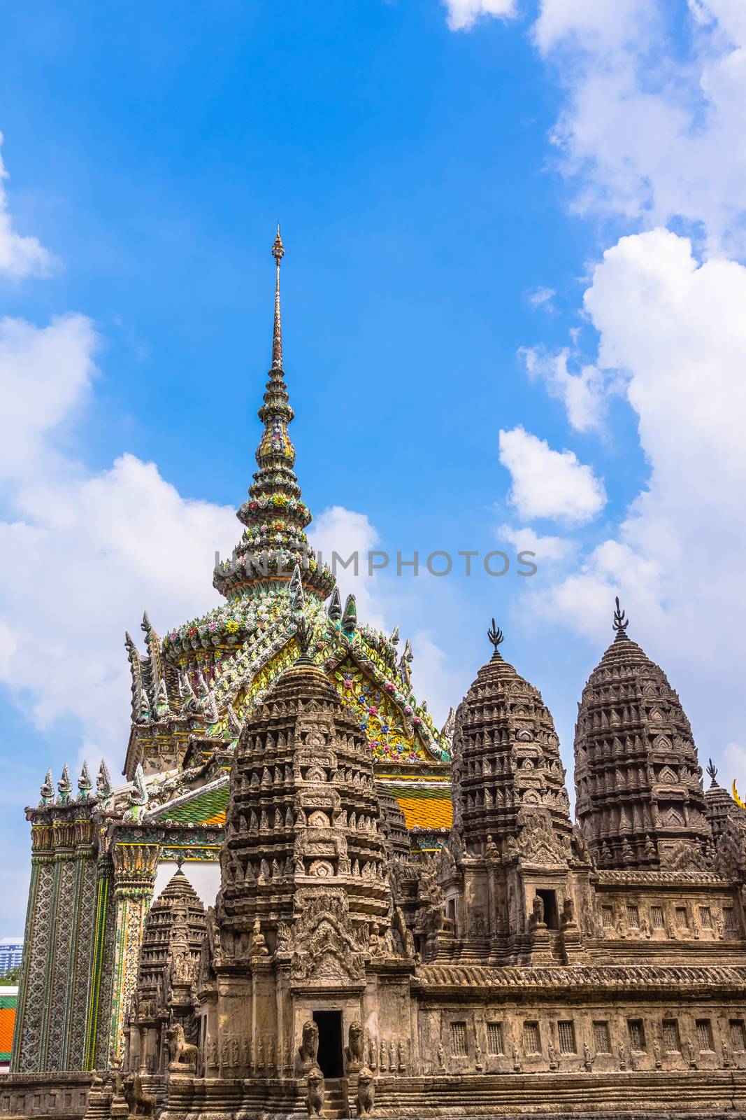 The Grand Palace complex in Bangkok, Thailand. In the foreground model of the Angkor Wat temple, the largest religious monument in the world located in Cambodia.