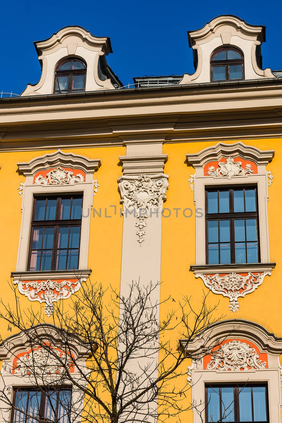 Facade of an ancient tenement in the Old Town in Krakow, Poland.