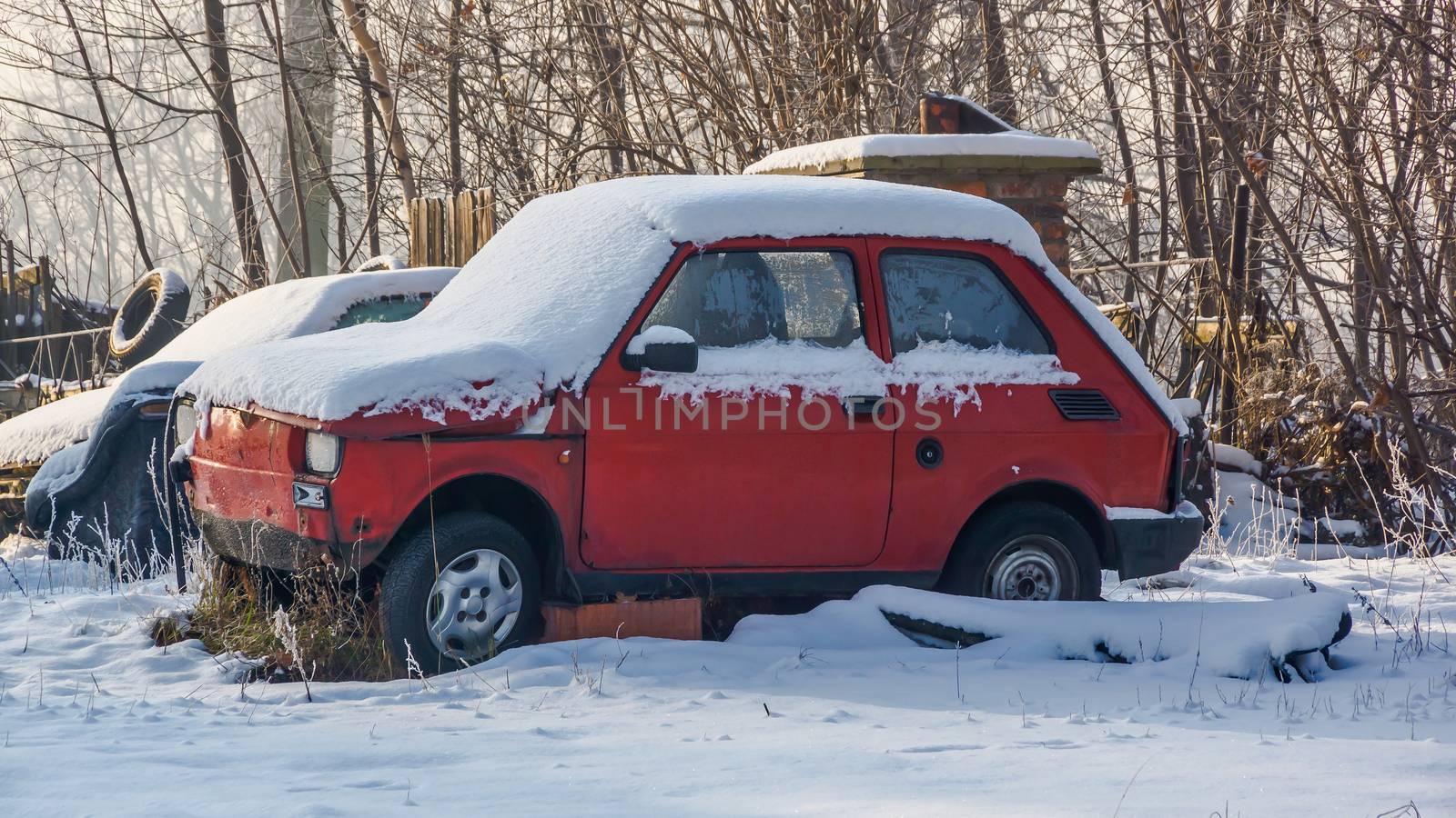 The old mini car in the garage yard, Katowice, Silesia region, Poland.