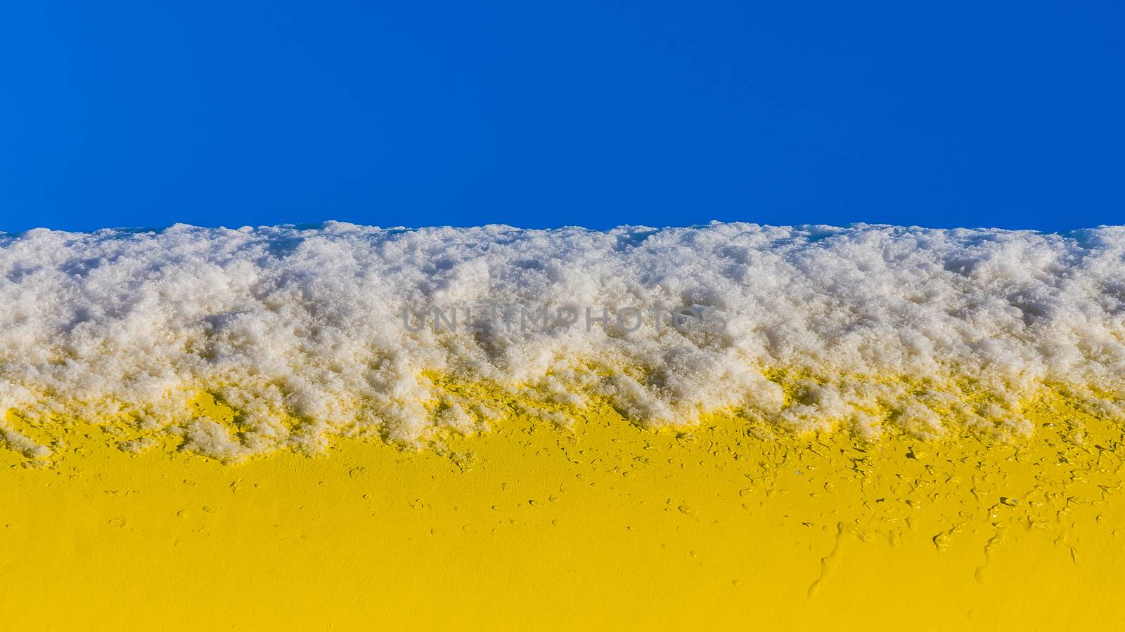 Snow on a yellow pipe by pawel_szczepanski