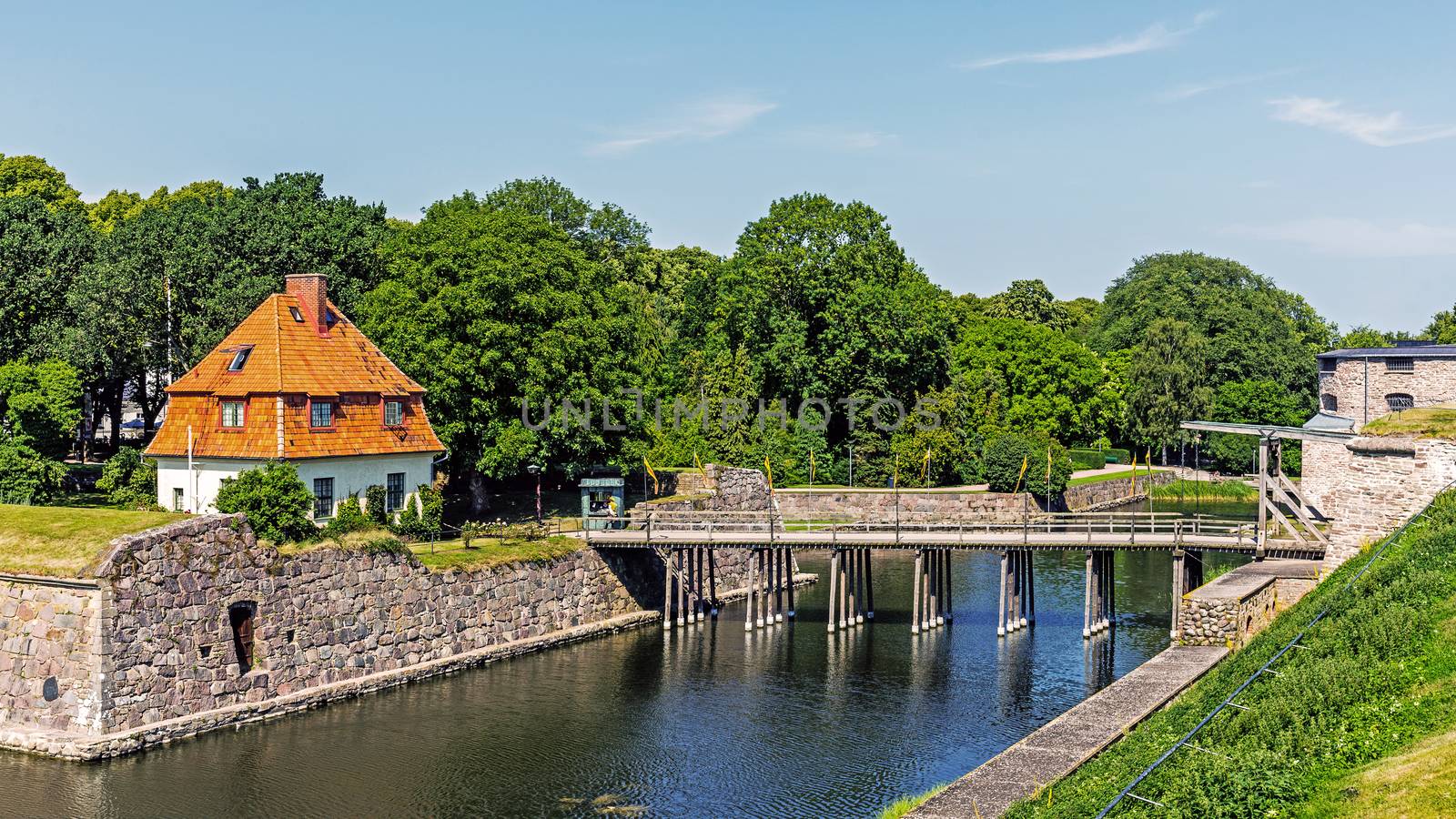View on the moat and bascule bridge of the Kalmar Castle. The castle dates back 800 years, reached current design during the 16th century, when rebuilt by Vasa kings.
