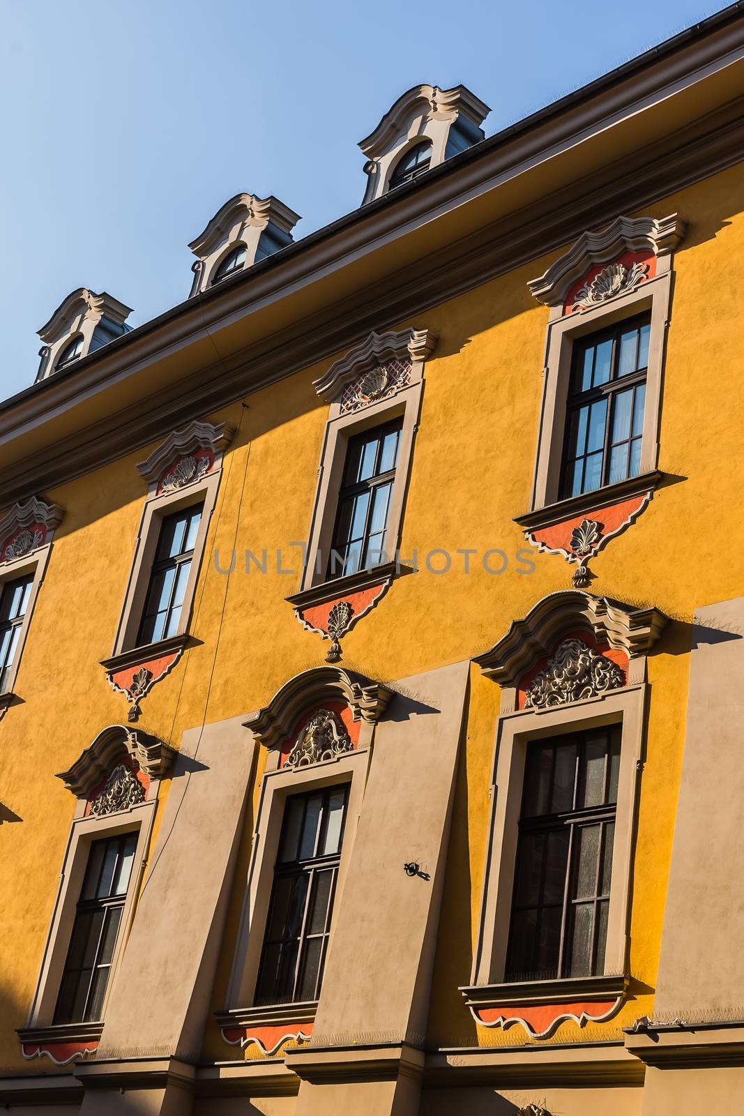 Facade of an ancient tenement in the Old Town in Krakow, Poland.
