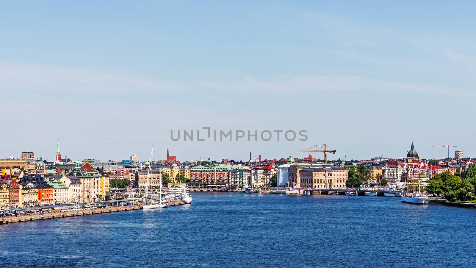 Panorama with Gamla stan (The Old Town) in Stockholm, main city attraction,  on the left. The town dates back to the 13th century with a rich collection of medieval architecture.