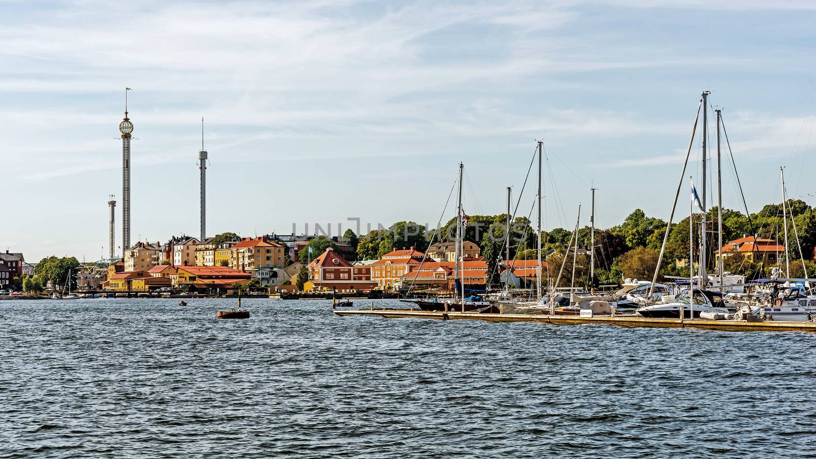Distant view on Grona Lund, the amusement park on the Djurgarden Island in Stockholm. The park is located amongst the old 19th century buildings originally designed not for the park.