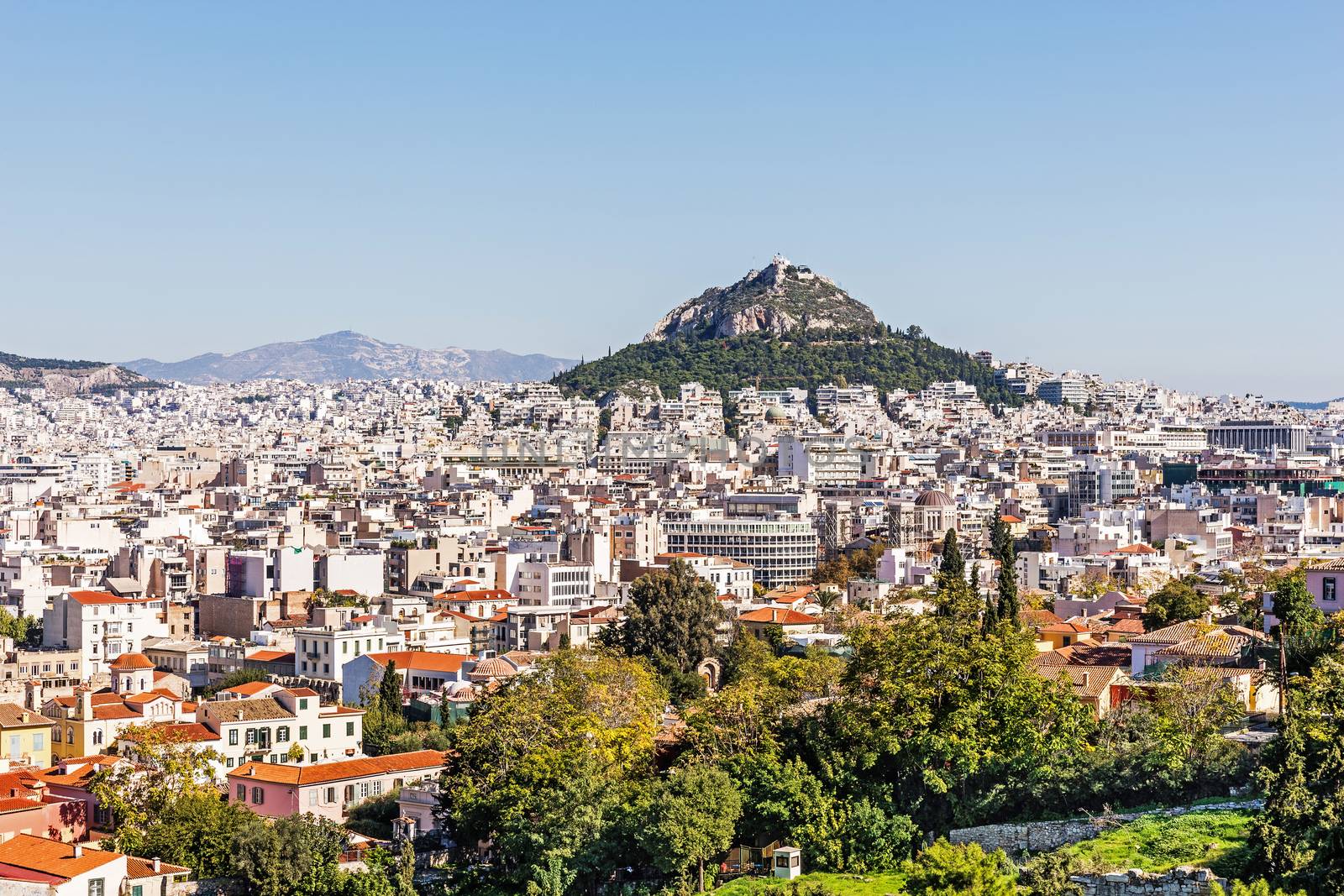 Mount Lycabettus in Athens, rising from the city a cretaceous limestone hill at 300 above sea level, with the 19th century Chapel of St. George at the peak.