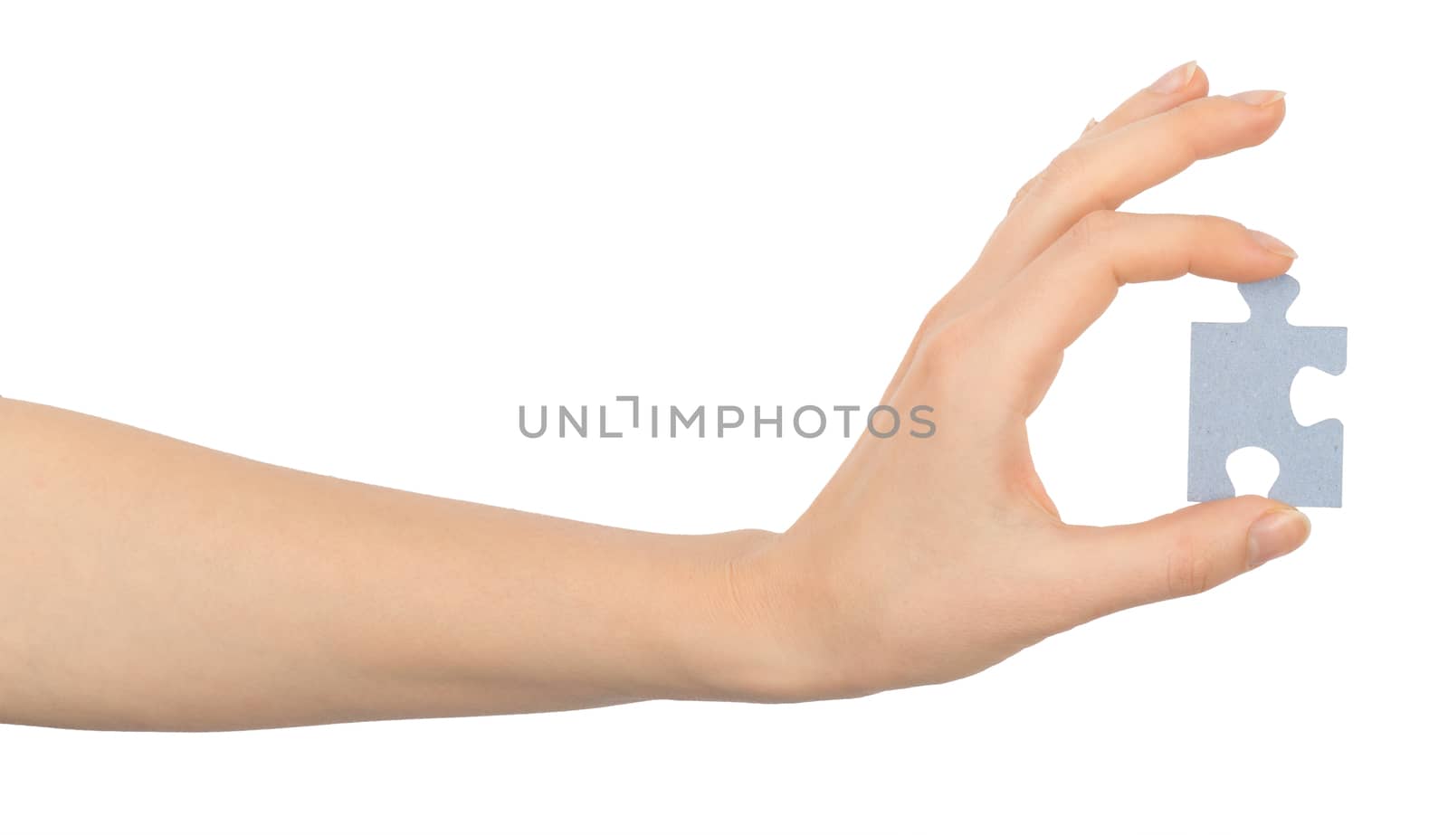 Hand holding puzzle piece on isolated white background