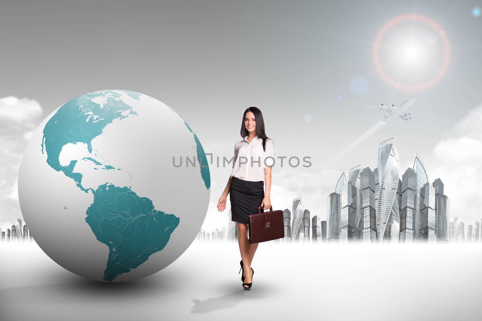 Buisnesswoman with big earth globe and city background