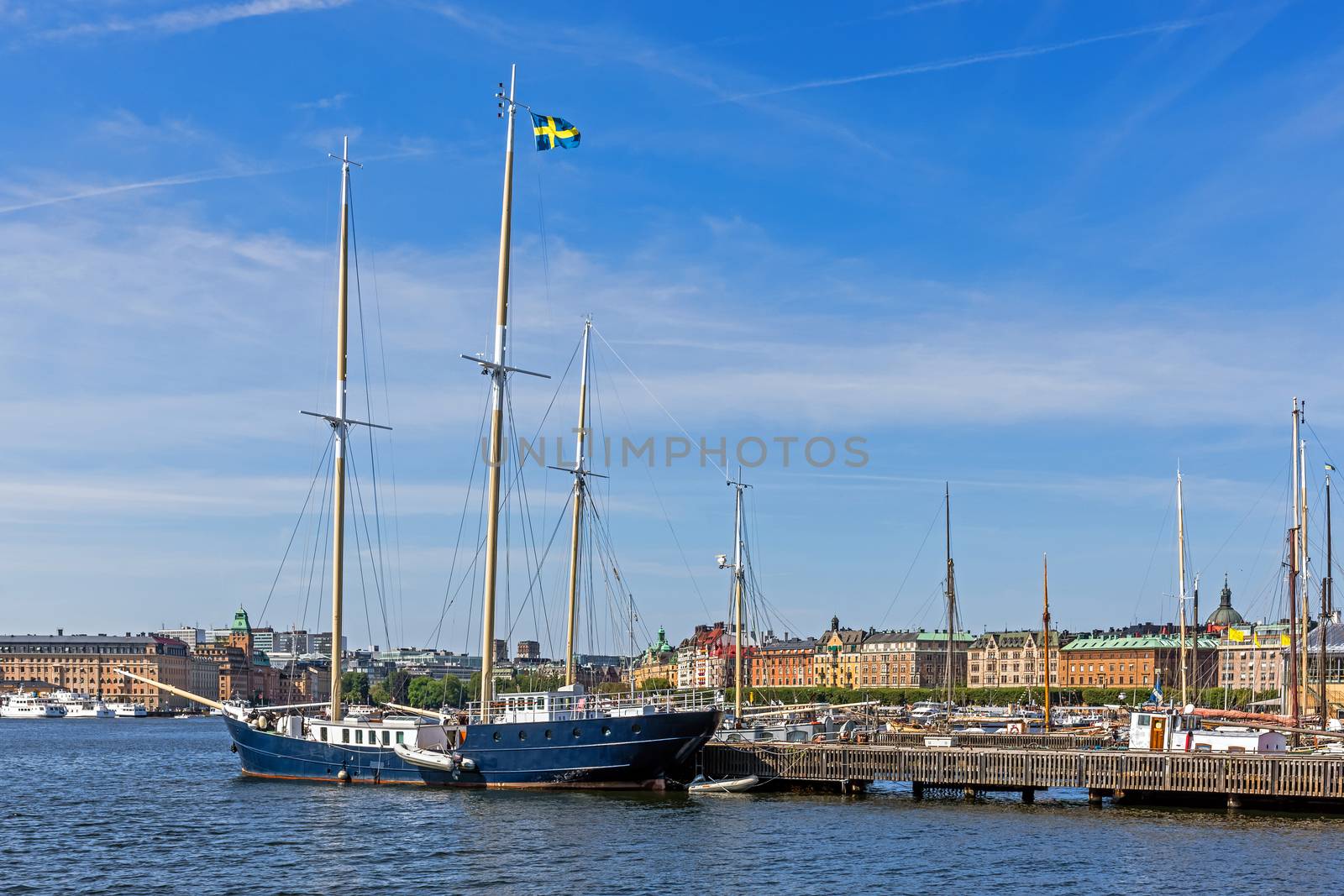 Sailboat moored in front of the Vasa Museum on the Djurgarden island. In the background Strandvagen, boulevard considered the most prestigious avenue in town.