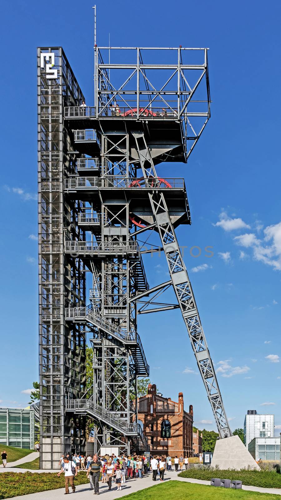 People queue to enter an observation deck on the mine shaft in the area of The Silesian Museum in Katowice. The museum combines old mining infrastructure with modern architecture