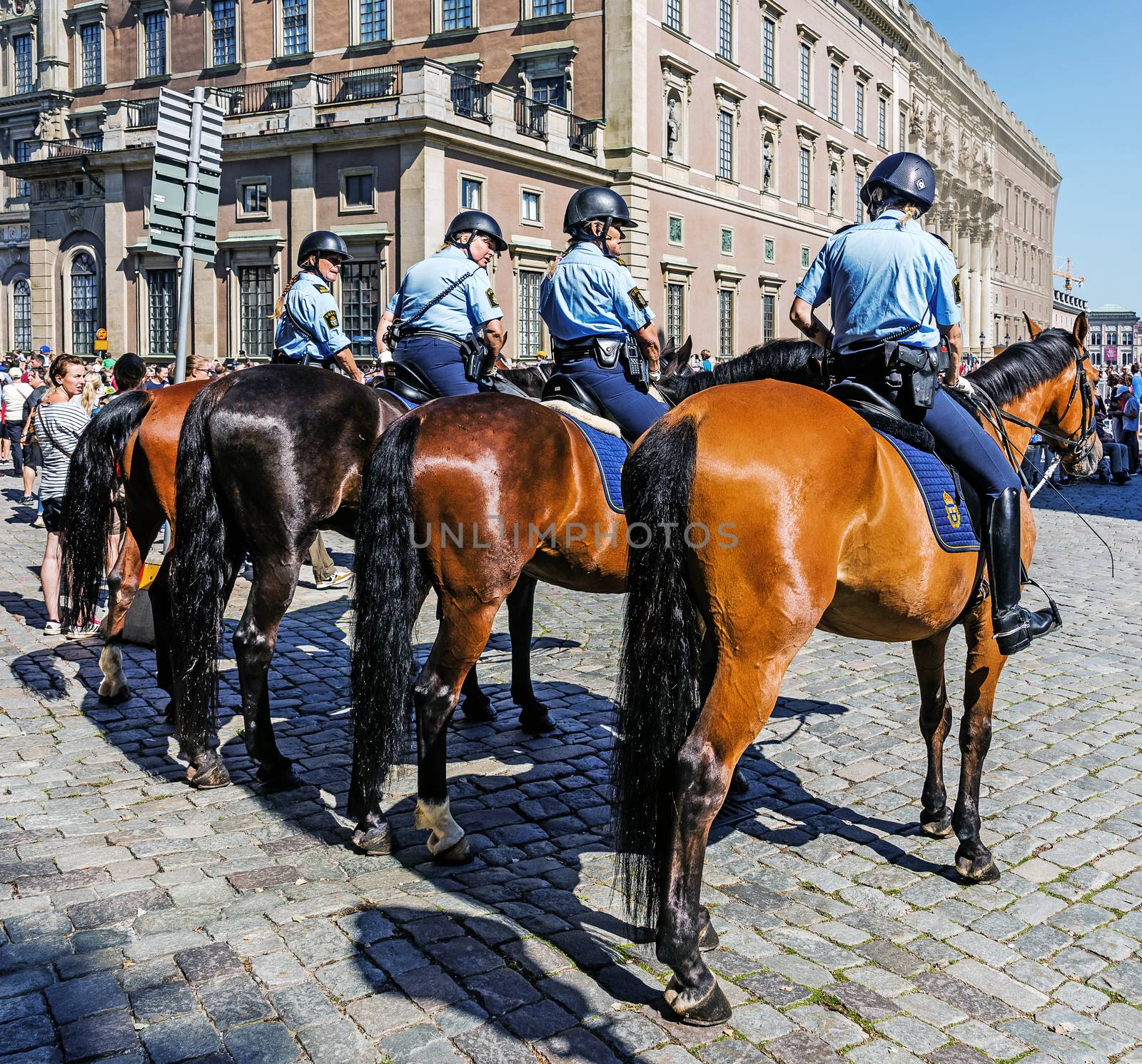 Female mounted patrol secures Changing of the Guard at the Royal Palace in Stockholm. The Royal Guard was established in 1523 and continuously guards the Royal Palace since then.