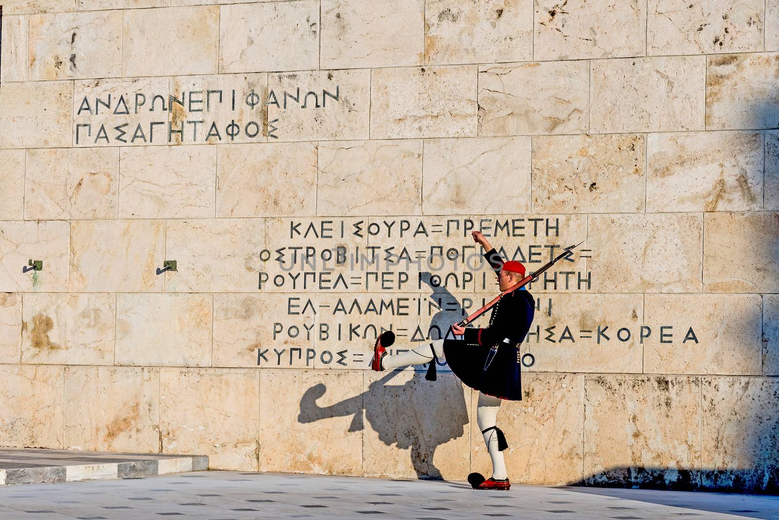 Changing of the guards at the Greek Tomb of the Unknown Soldier in Athens The guard is held by The Evezones, a ceremonial traditionally uniformed unit of The Presidential Guard.