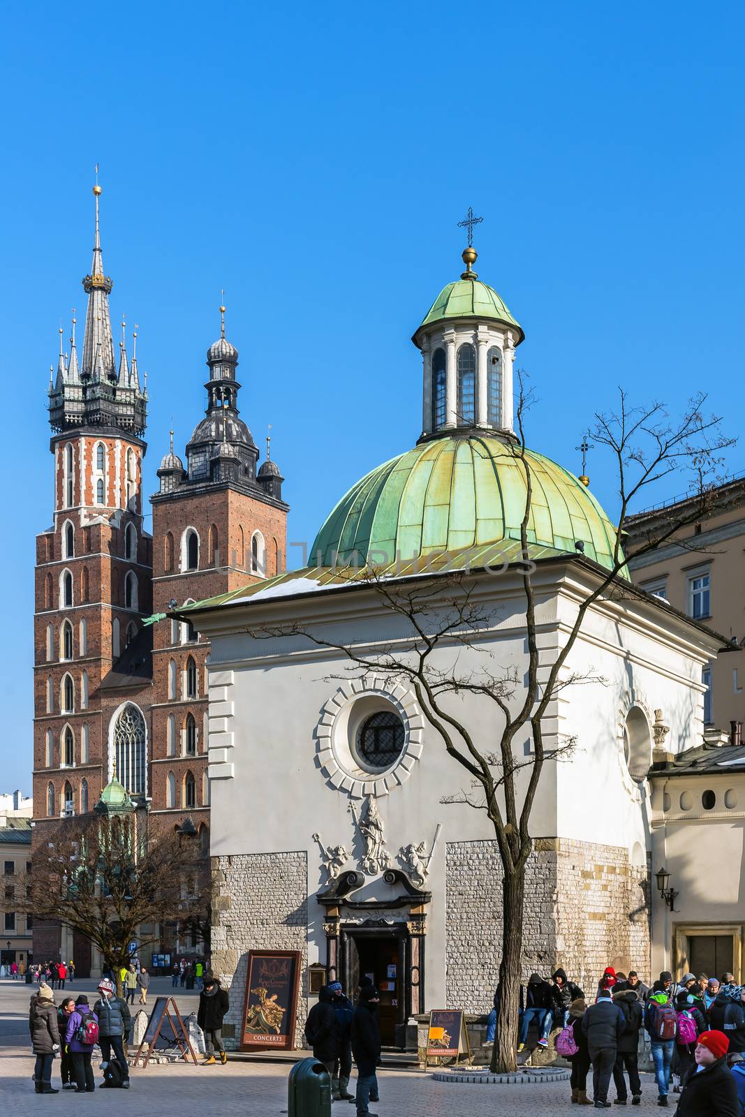 St. Adalbert (in the foreground) and St. Mary churches in the Main Square in Krakow, the most popular destination in Poland, full of many attractions for tourists.
