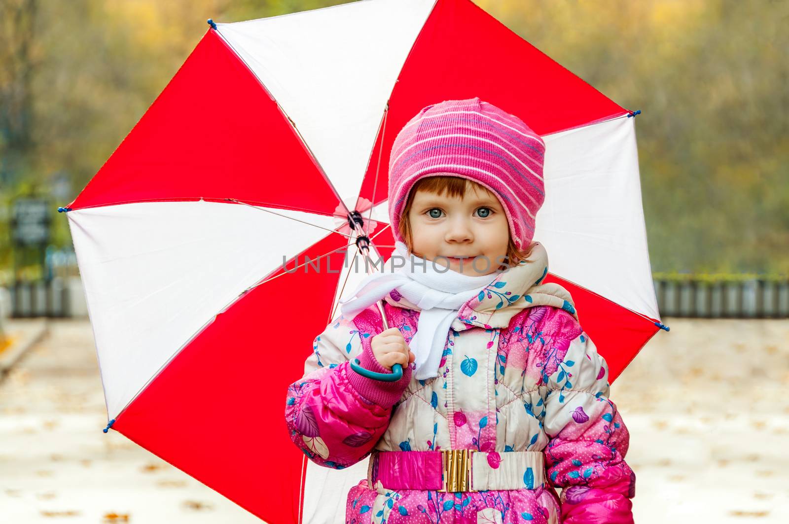 Portrait of a little girl with an umbrella