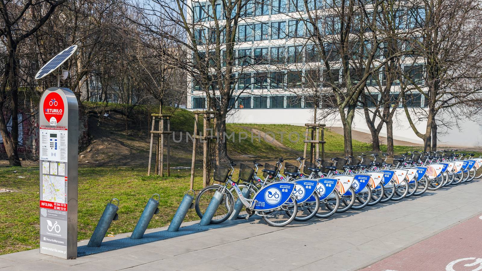 One of 198 bike stations  in Warsaw by Veturilo company that offers in total 2968 bikes for rental. Traversing the city on a bike is nowadays popular and fashionable.