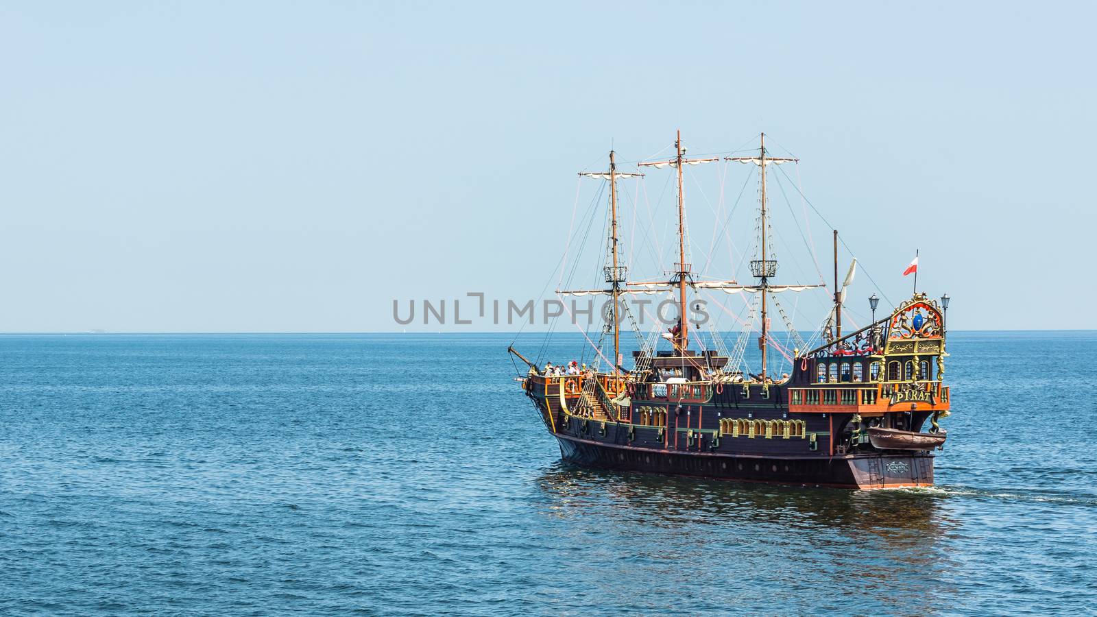 Pleasure boat, designed in old pirate frigate style, by the pier in Sopot. Pleasure cruises are one of the most popular summer attractions in the resort.