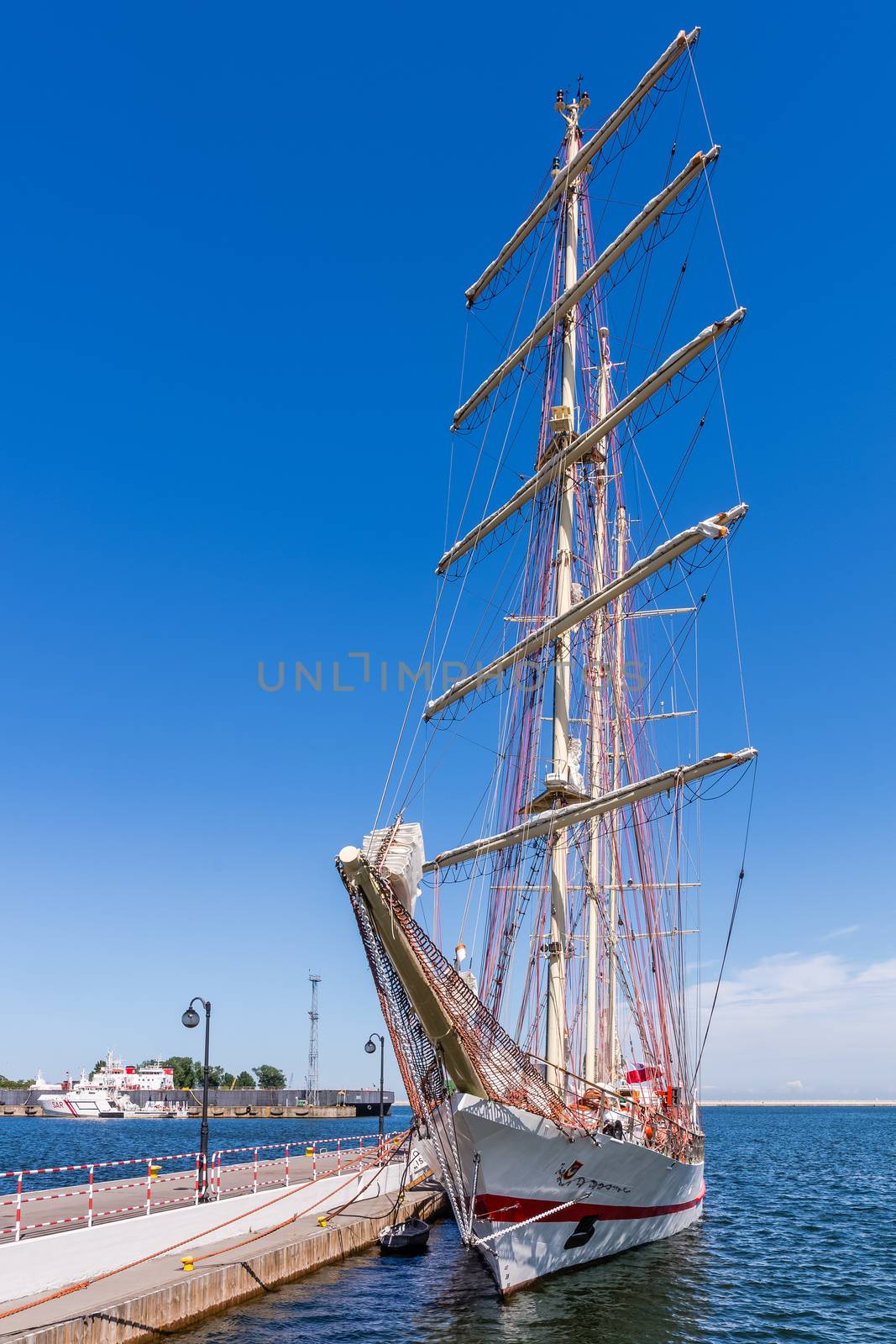 Sailboat moored at the quay in the Port of Gdynia, the third largest seaport in Poland specialized in handling containers, ro-ro and ferry.