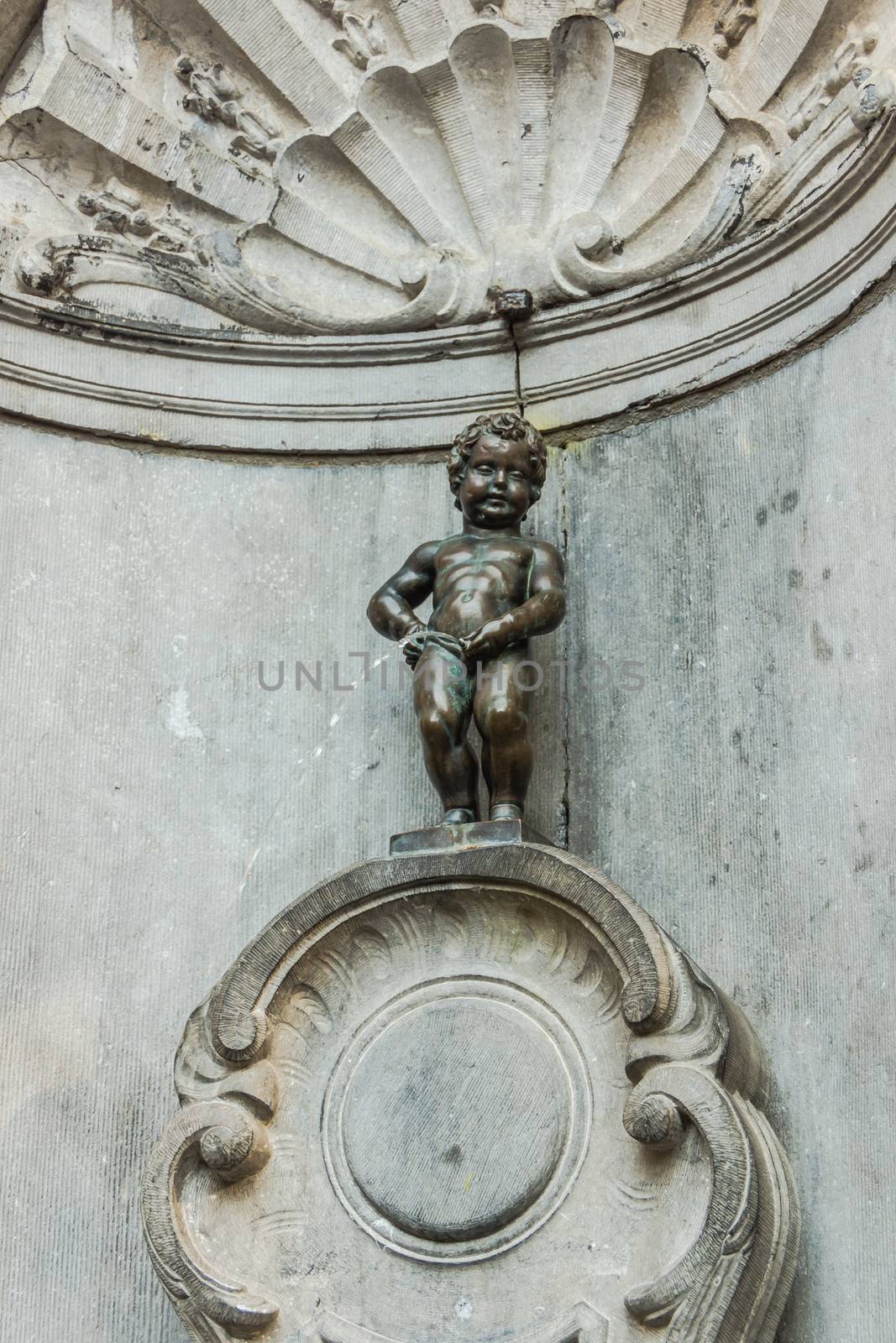 Manneken Pis (Peeing Boy), famous symbol of the city, on May 02, 2013. Due to repeated thefts only the copy is exposed, the original is kept at the King’s House on the Grand Place.