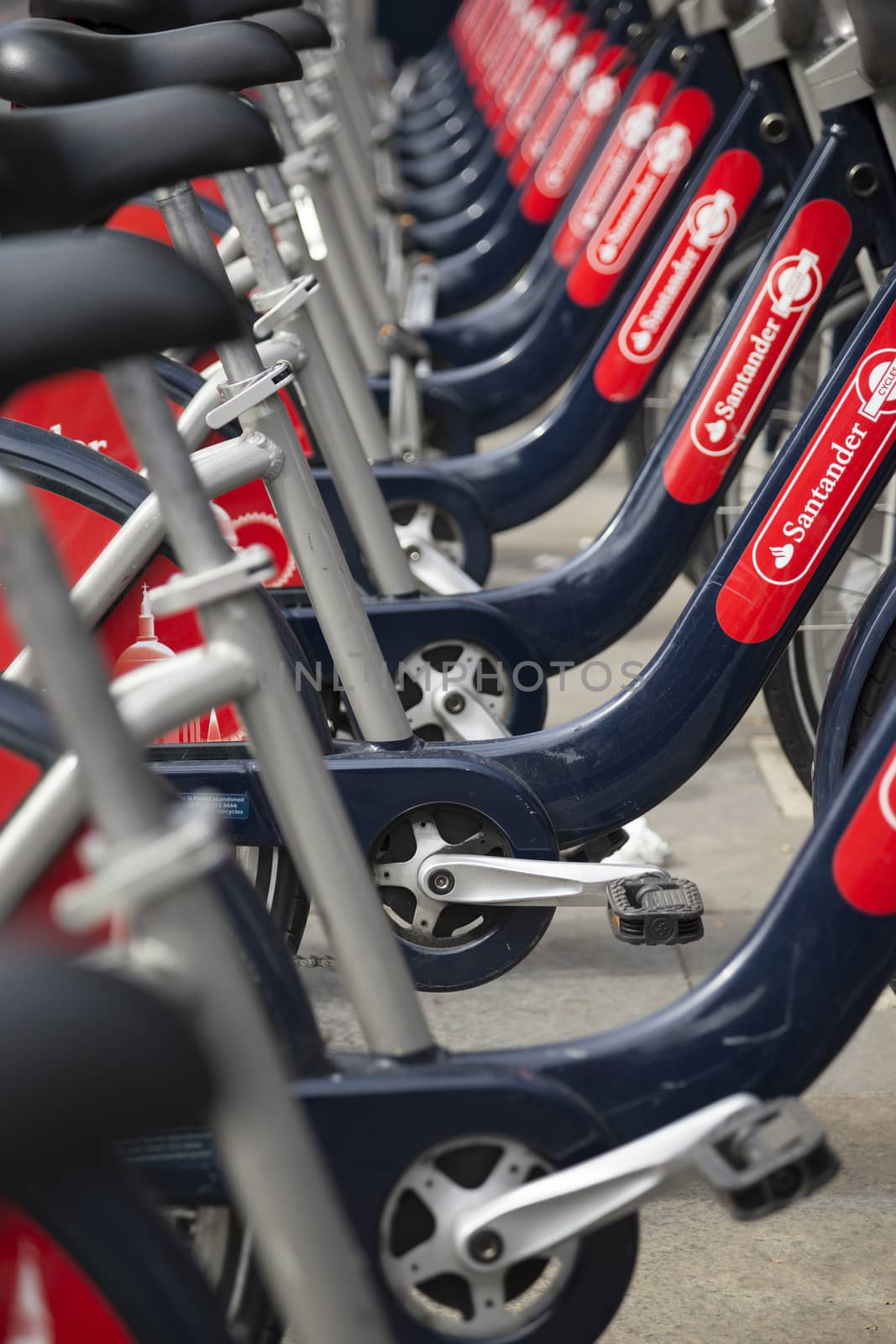 London, UK - September 13, 2015: Rental Bicycles in London, UK. The public bicycle rental scheme in London, coloquially known as "Boris Bikes" are sposored by the bank Santander.